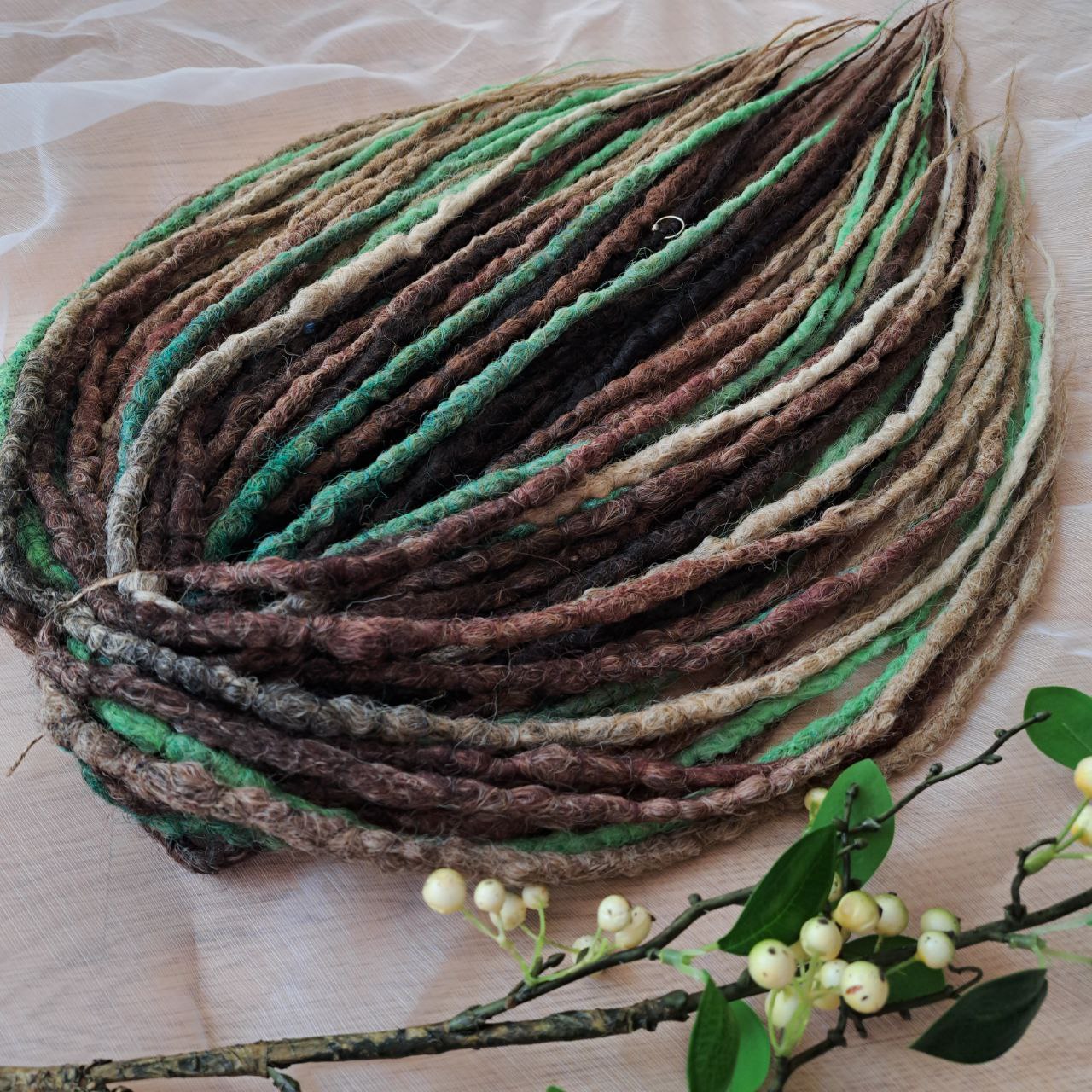 Forest Spirit - textured crochet dreads capture the calm, grounding energy of nature. The mix of moss green, chestnut brown, and sandy beige creates a rich, organic palette that feels both wild and soothing. This set brings a forest-inspired balance — warm earth tones with a hint of fresh green life. 