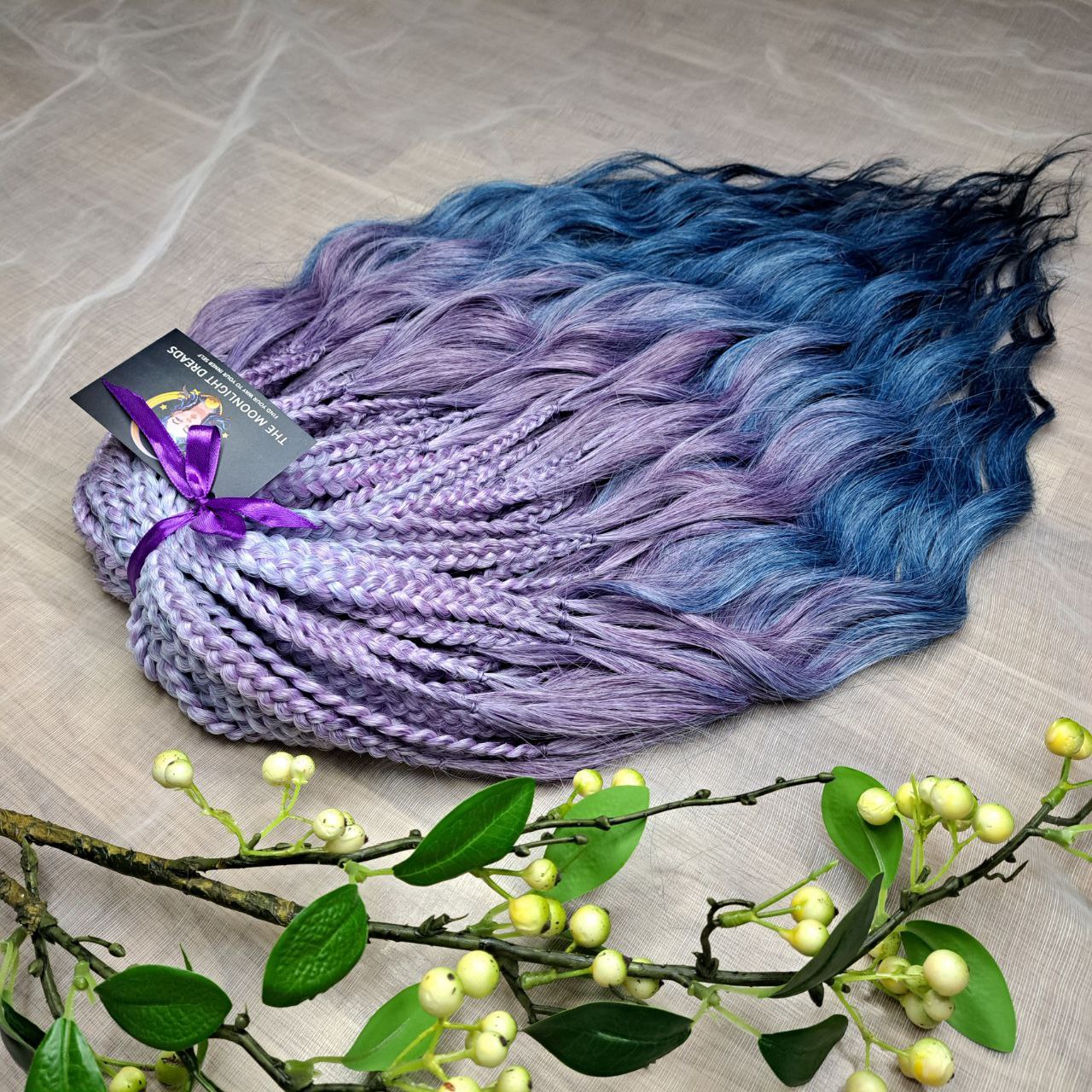 Ready to ship: 50 DE Indigo Lavender BRUSHABLE synthetic curls with braided middle

This set features a smooth lavender-to-indigo gradient with cool, clean tones and a soft transition between shades. Soft, lightweight, and reusable 50 double ended synthetic braids with loose wavy brushable ends.

Length: ±22-24 inches (55-50 cm)
Braided part of curls ±4-5 inches (11-13 cm) folded
Weight: ±350 gr (12,35 oz)