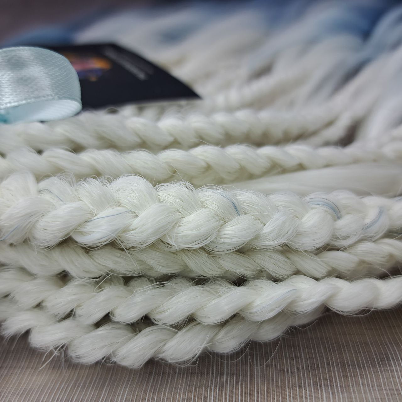 Ombre from clean icy blonde roots into smoky steel blue, deepening into rich navy blue at the ends - soft, lightweight, brushable, and reusable synthetic double-ended brushable curls (regular dreaded, braided middle or push-up).