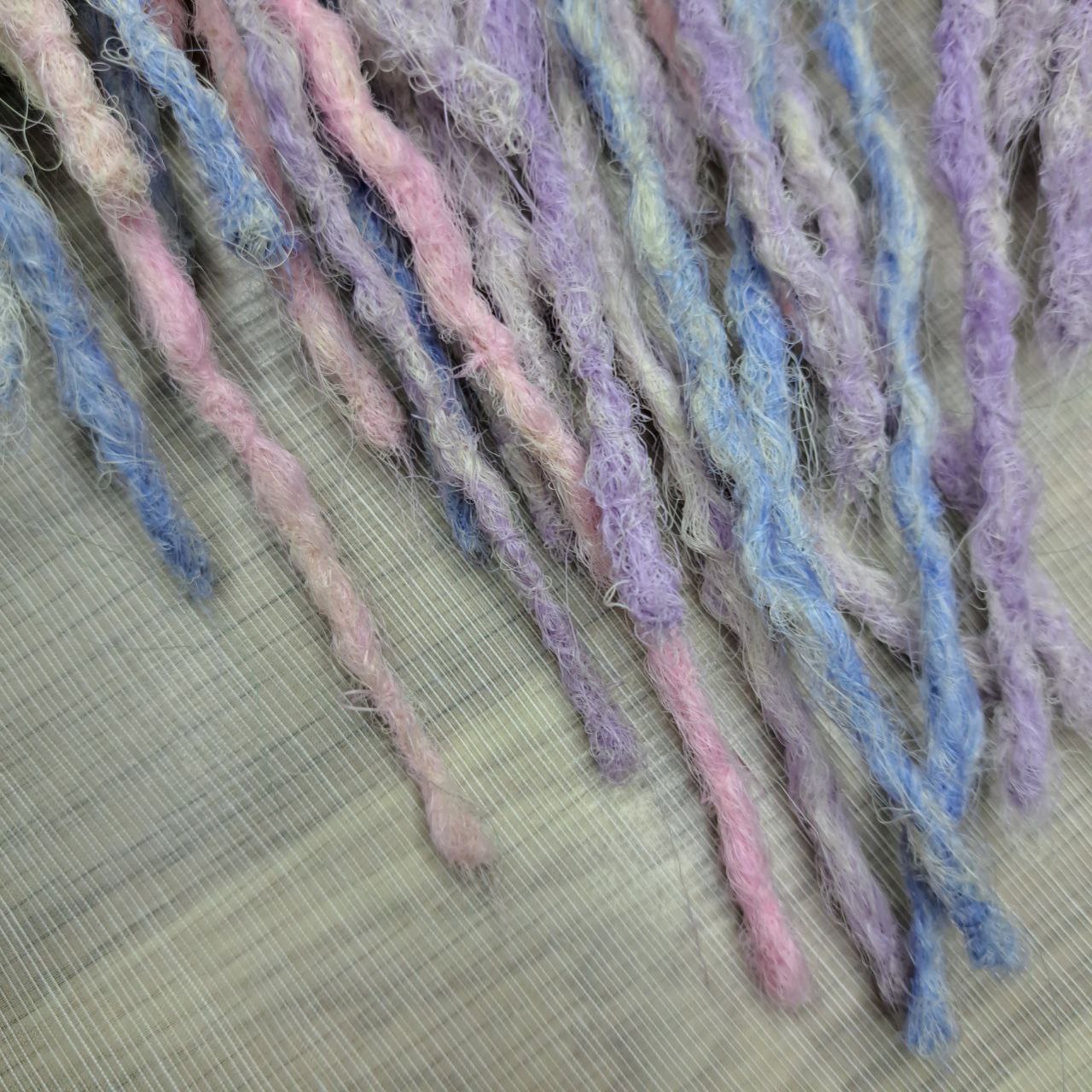 Pastel Cloud - a soft pastel mix of lavender, baby blue, blush pink, and creamy blonde. Soft, lightweight, and reusable 49 double ended synthetic bumpy dreadlocks with blunt ends give a calm, airy look.

Length: ≈15-16 inches (≈38-40 cm)
Thickness of dreads and braids: ≈0.8-1 cm
Weight: ≈260 gr (≈9,17 oz)