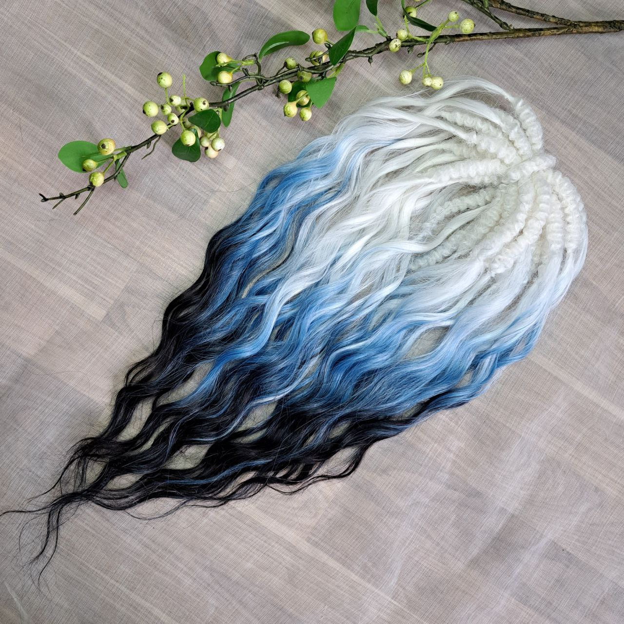 Ombre from clean icy blonde roots into smoky steel blue, deepening into rich navy blue at the ends - soft, lightweight, brushable, and reusable synthetic double-ended brushable curls (regular dreaded, braided middle or push-up).