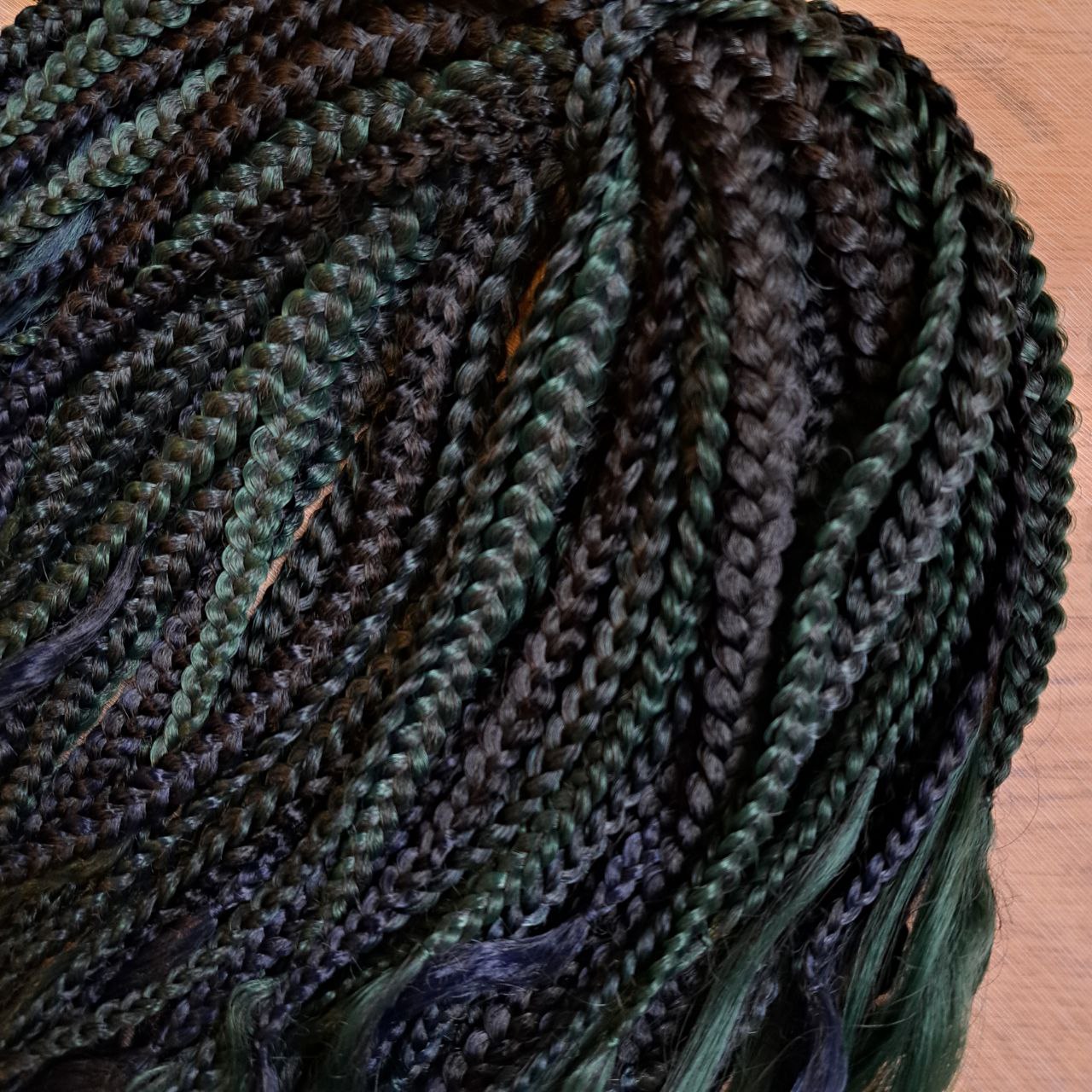 Midnight Forest - A deep blend of navy blue, dark teal, and forest green with a smooth, natural transition. Soft, lightweight, and reusable set of 54 double ended synthetic brushable curls with braided middle.

Length: ±25-26 inches (63-66 cm)
Braided part of curls ±10 inches  (25 cm) folded - 20" (50 cm) total.
Weight: ±390 gr (13,8 oz)