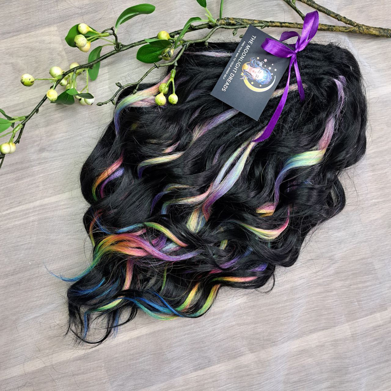 Black Rainbow - 60 DE soft, lightweight, and reusable synthetic standard dreaded brushable curls Manasi. Black base blended with rainbow/prism/glitch effect accents. 

Length: 16 inches (40 cm)
Dreaded part: approximately 3-4 inches (8-10 cm)
Weight: ±300 gr (10,6 oz)