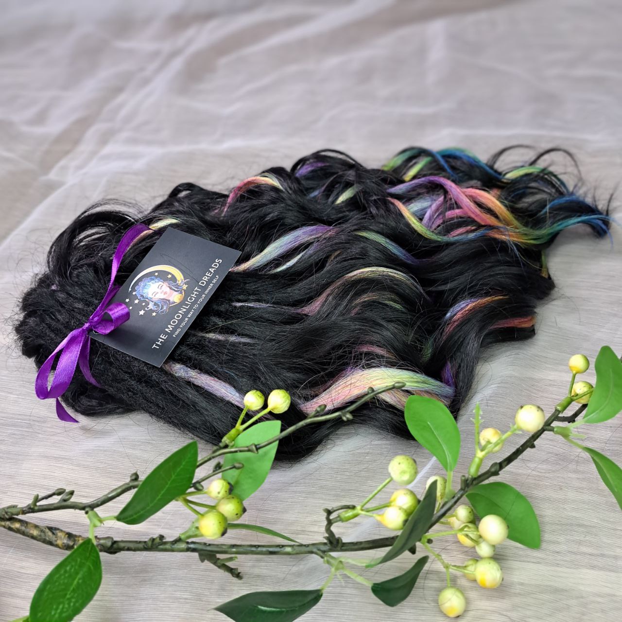 Black Rainbow - 60 DE soft, lightweight, and reusable synthetic standard dreaded brushable curls Manasi. Black base blended with rainbow/prism/glitch effect accents. 

Length: 16 inches (40 cm)
Dreaded part: approximately 3-4 inches (8-10 cm)
Weight: ±300 gr (10,6 oz)