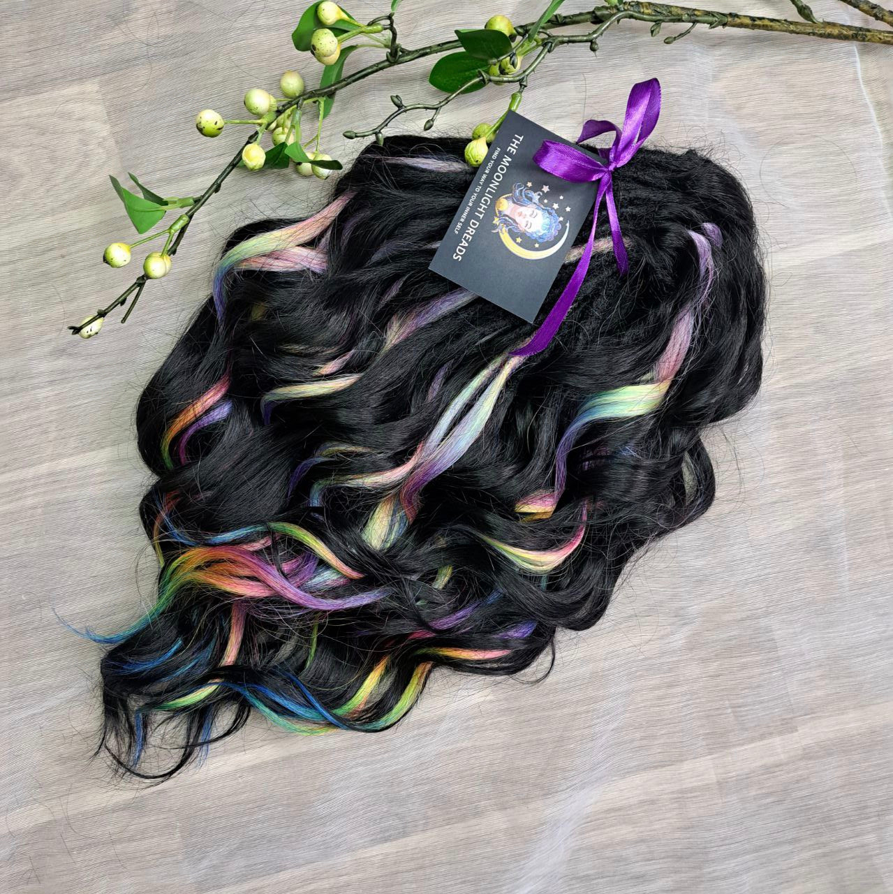 Black Rainbow - 60 DE soft, lightweight, and reusable synthetic standard dreaded brushable curls Manasi. Black base blended with rainbow/prism/glitch effect accents. 

Length: 16 inches (40 cm)
Dreaded part: approximately 3-4 inches (8-10 cm)
Weight: ±300 gr (10,6 oz)