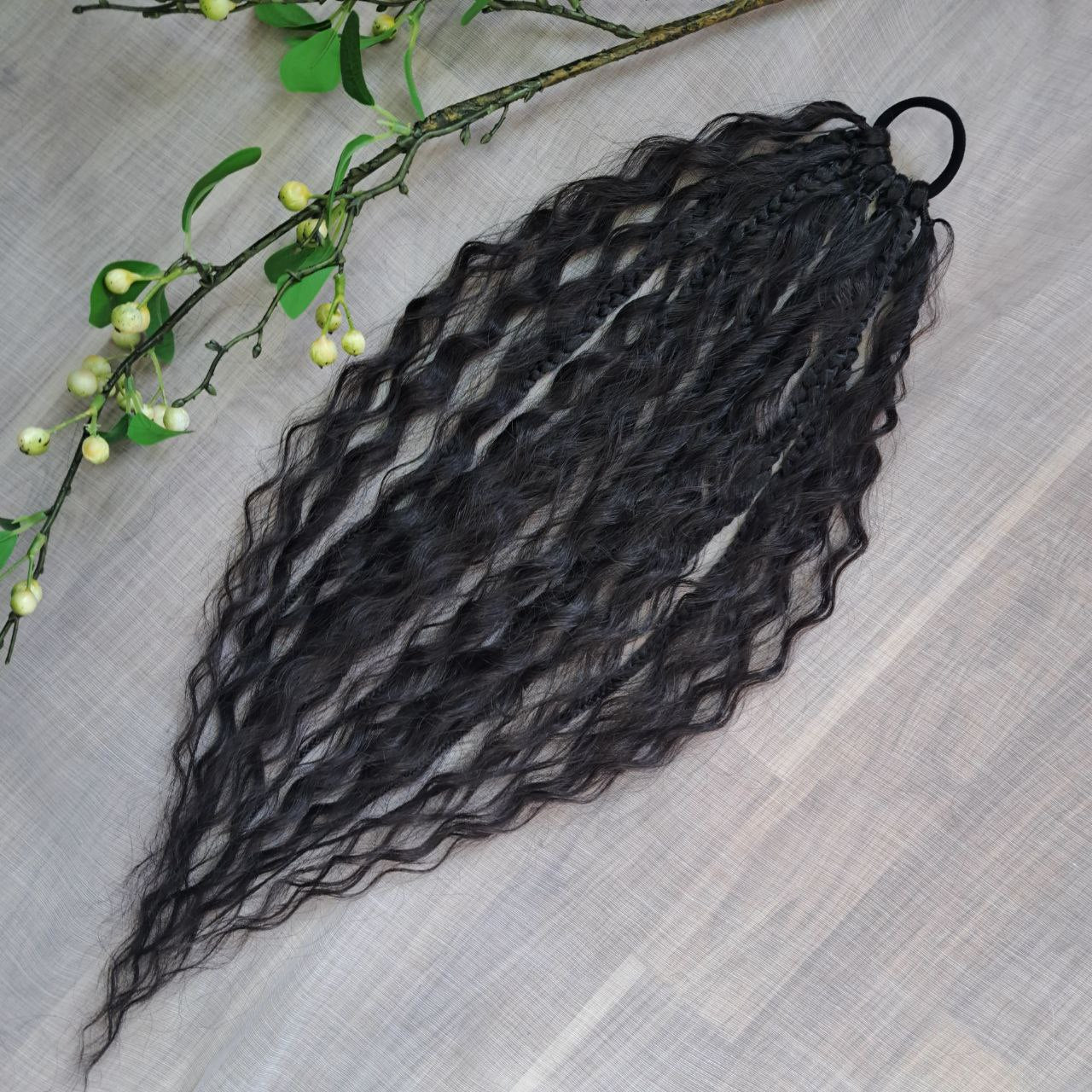 Braids, dreads, and curls on an elastic band — a simple way to transform a ponytail without installing a set. Easy to put on and remove whenever you like. A great option if you can’t install dreads or braids. Also, a perfect gift for kids 🎁

These scrunchies add instant length, volume, and texture — whether you prefer bold colors or natural shades.

Length: 22–24 inches.
Each hair tie includes 12–14 pieces, depending on the style.

Choose from the available designs shown, or contact us for a custom order.