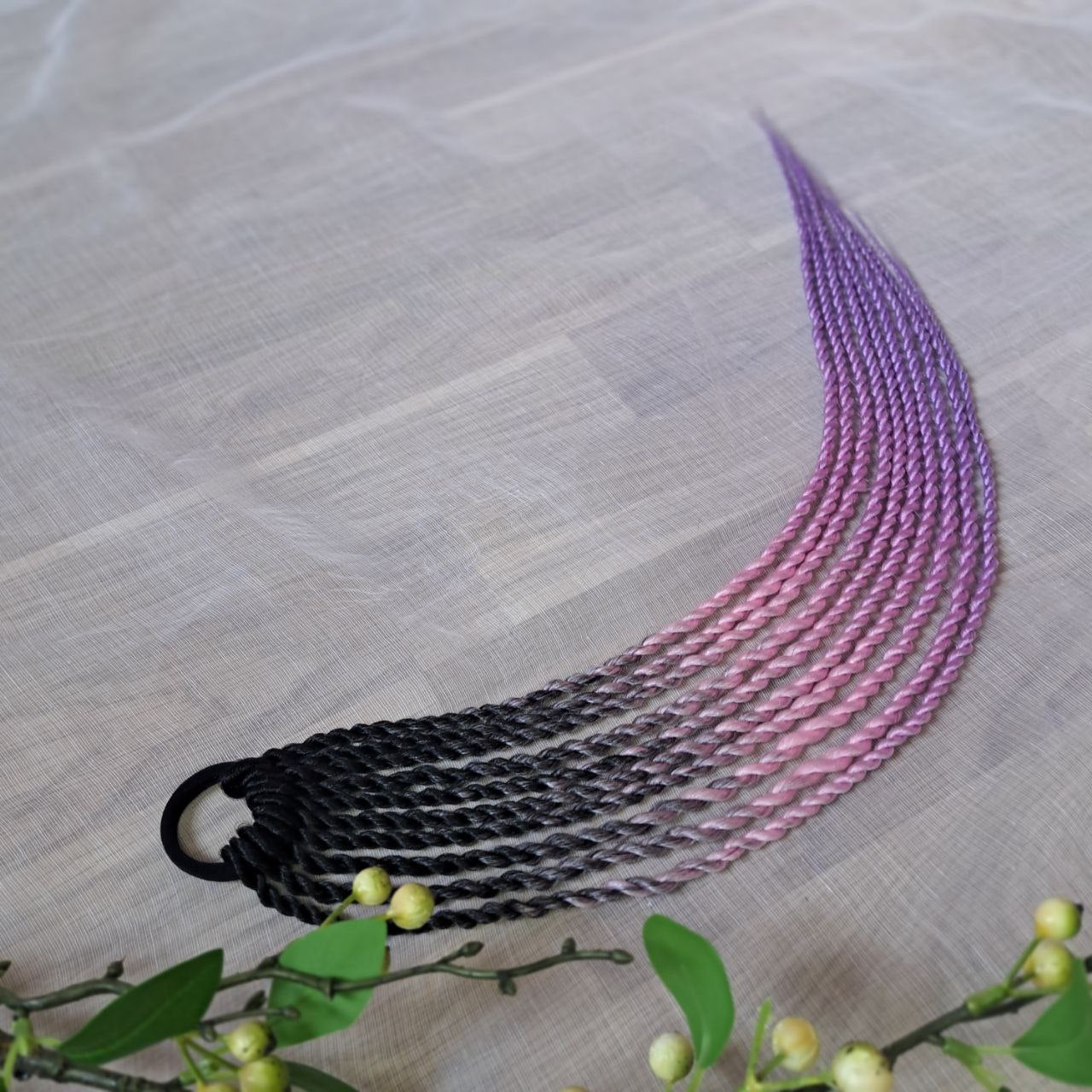 Braids, dreads, and curls on an elastic band — a simple way to transform a ponytail without installing a set. Easy to put on and remove whenever you like. A great option if you can’t install dreads or braids. Also, a perfect gift for kids 🎁

These scrunchies add instant length, volume, and texture — whether you prefer bold colors or natural shades.

Length: 22–24 inches.
Each hair tie includes 12–14 pieces, depending on the style.

Choose from the available designs shown, or contact us for a custom order.