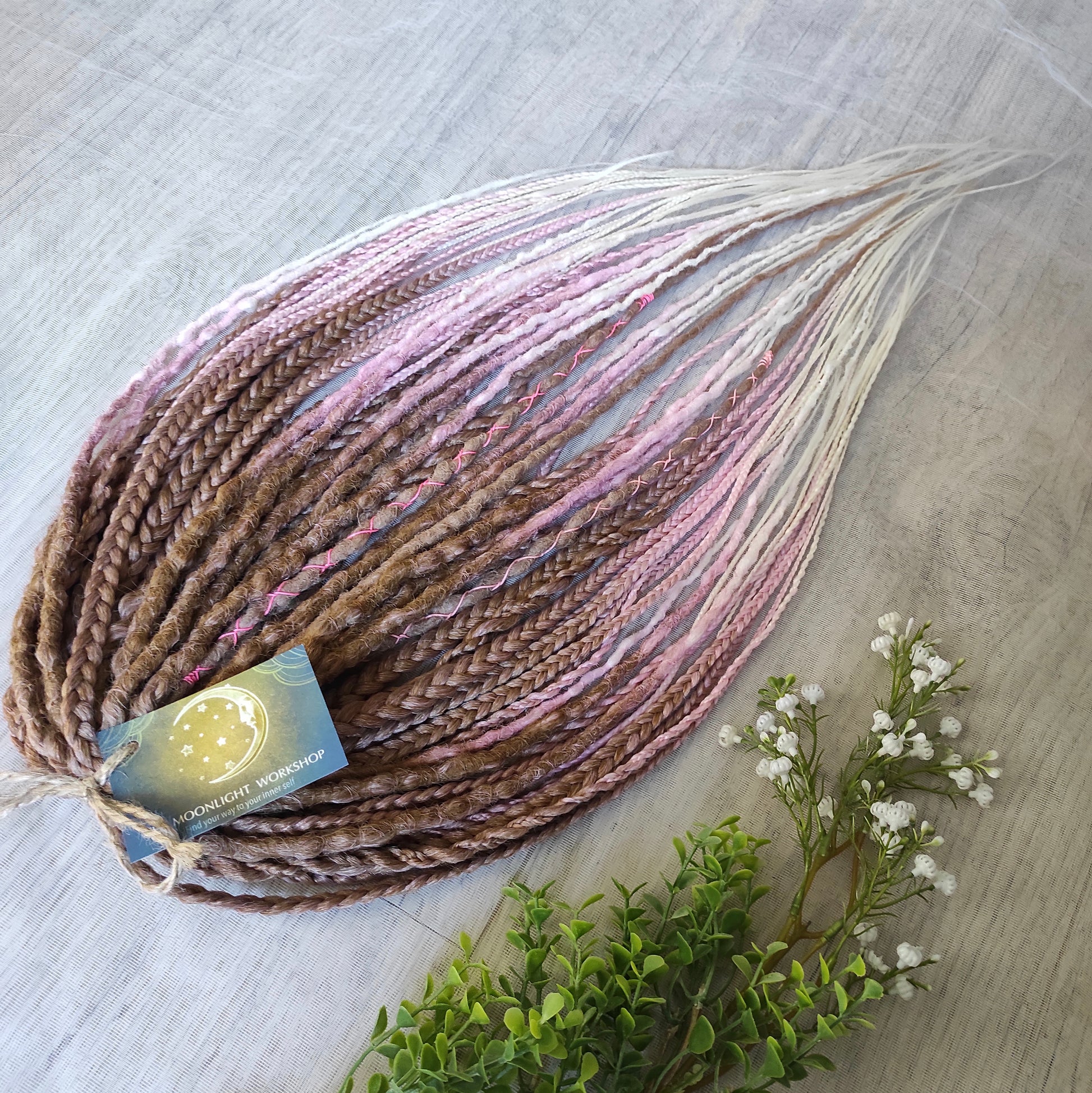 IceCream – double ended synthetic crochet dreadlocks and braids.
At the roots, the color starts with warm caramel and nude blonde tones, gradually transitioning towards the ends into delicate pastel pink and platinum blonde. The gradient is smooth and airy, with a light pastel feel and no harsh contrasts.

A soft, creamy blend inspired by strawberry and vanilla ice cream in a waffle cone.