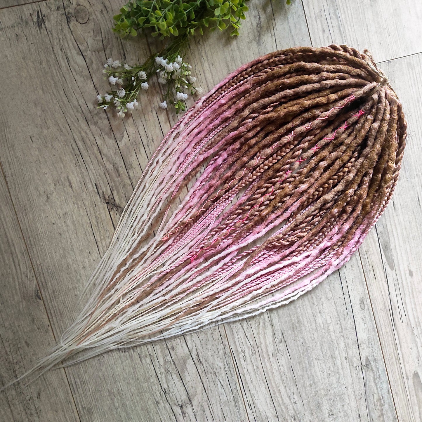 IceCream – double ended synthetic crochet dreadlocks and braids.
At the roots, the color starts with warm caramel and nude blonde tones, gradually transitioning towards the ends into delicate pastel pink and platinum blonde. The gradient is smooth and airy, with a light pastel feel and no harsh contrasts.

A soft, creamy blend inspired by strawberry and vanilla ice cream in a waffle cone.