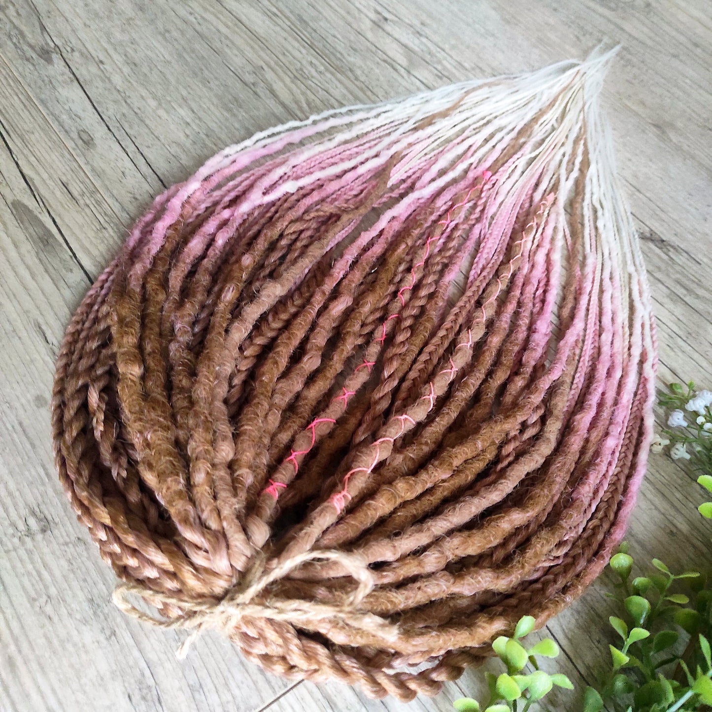 IceCream – double ended synthetic crochet dreadlocks and braids.
At the roots, the color starts with warm caramel and nude blonde tones, gradually transitioning towards the ends into delicate pastel pink and platinum blonde. The gradient is smooth and airy, with a light pastel feel and no harsh contrasts.

A soft, creamy blend inspired by strawberry and vanilla ice cream in a waffle cone.