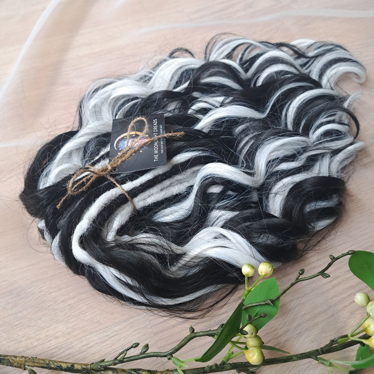 Black & White soft, lightweight, and reusable 60 double ended synthetic standard dreaded brushable curls

Length: 16 inches (40 cm)
Dreaded part: approximately 3-4 inches (8-10 cm)
Weight: ±300 gr (10,6 oz)