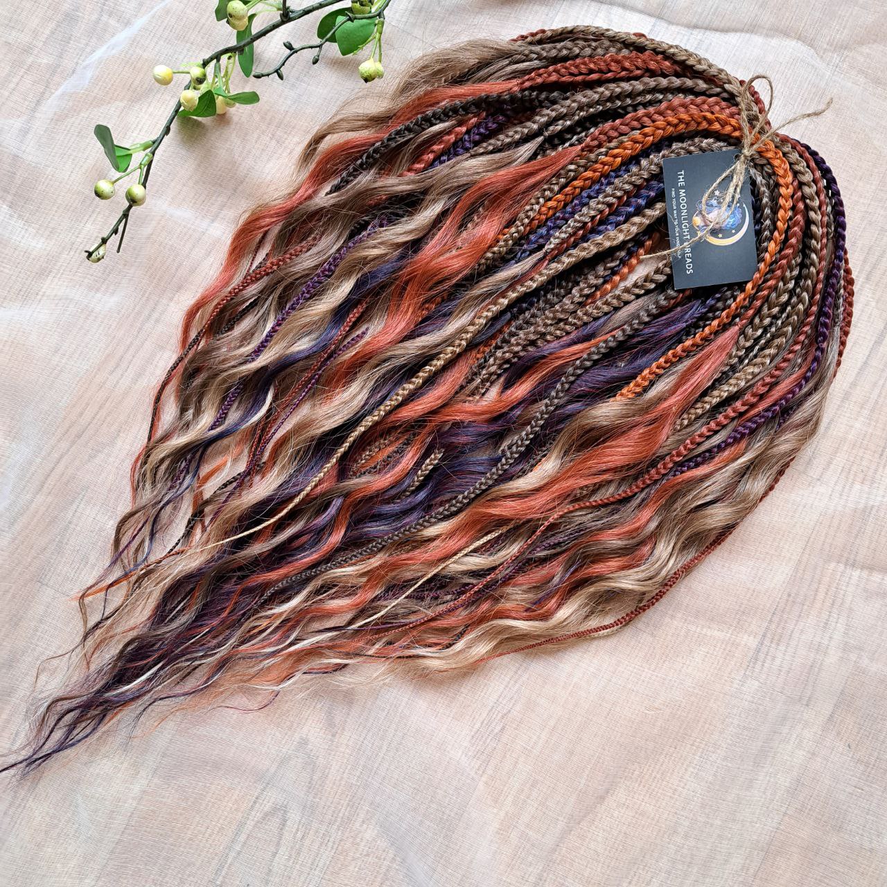 Inspired by the original Spiced Ember set, this version combines regular braids and curls with a braided middle, all in the warmth and depth of autumn hues. Here, rich amber and copper shades are balanced by earthy brown, honey caramel, and subtle chestnut notes — creating a natural yet vibrant color harmony.

Standard length: ±22-24 inches (55-60 cm)
Thickness of braids: ±0.8 cm
Braided part of curls: ±4–5 inches folded (total ±8–10 inches)