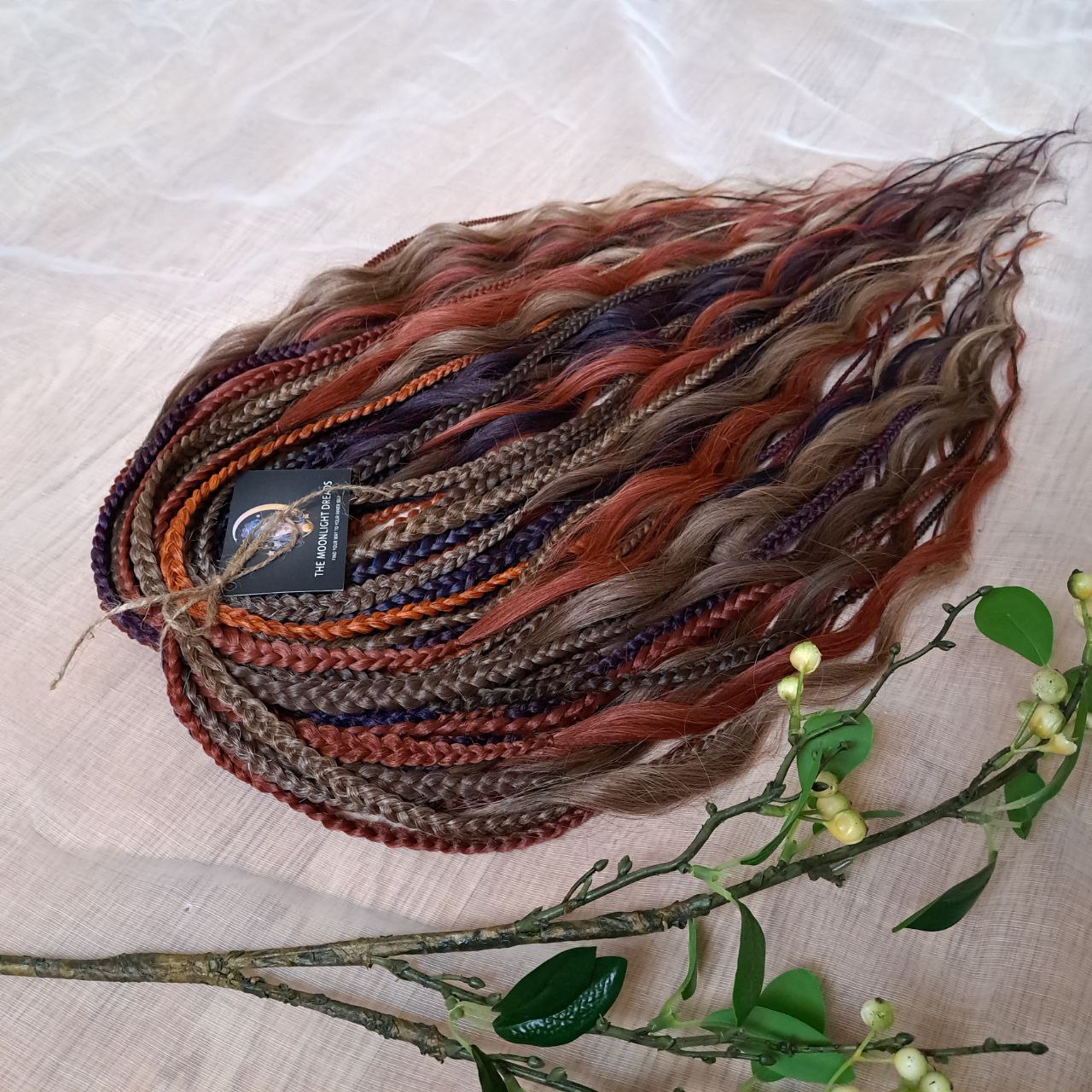 Inspired by the original Spiced Ember set, this version combines regular braids and curls with a braided middle, all in the warmth and depth of autumn hues. Here, rich amber and copper shades are balanced by earthy brown, honey caramel, and subtle chestnut notes — creating a natural yet vibrant color harmony.

Standard length: ±22-24 inches (55-60 cm)
Thickness of braids: ±0.8 cm
Braided part of curls: ±4–5 inches folded (total ±8–10 inches)