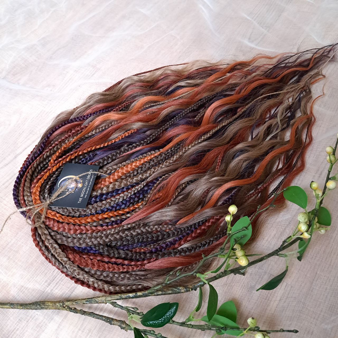 Inspired by the original Spiced Ember set, this version combines regular braids and curls with a braided middle, all in the warmth and depth of autumn hues. Here, rich amber and copper shades are balanced by earthy brown, honey caramel, and subtle chestnut notes — creating a natural yet vibrant color harmony.

Standard length: ±22-24 inches (55-60 cm)
Thickness of braids: ±0.8 cm
Braided part of curls: ±4–5 inches folded (total ±8–10 inches)