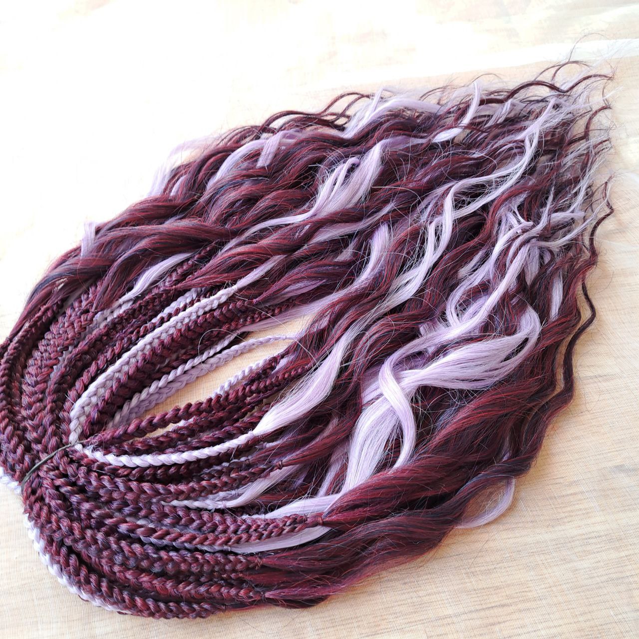 Plum Lilac - the base shade is a deep plum purple, combined with soft lilac strands. Soft, lightweight, and reusable double ended synthetic brushable curls.