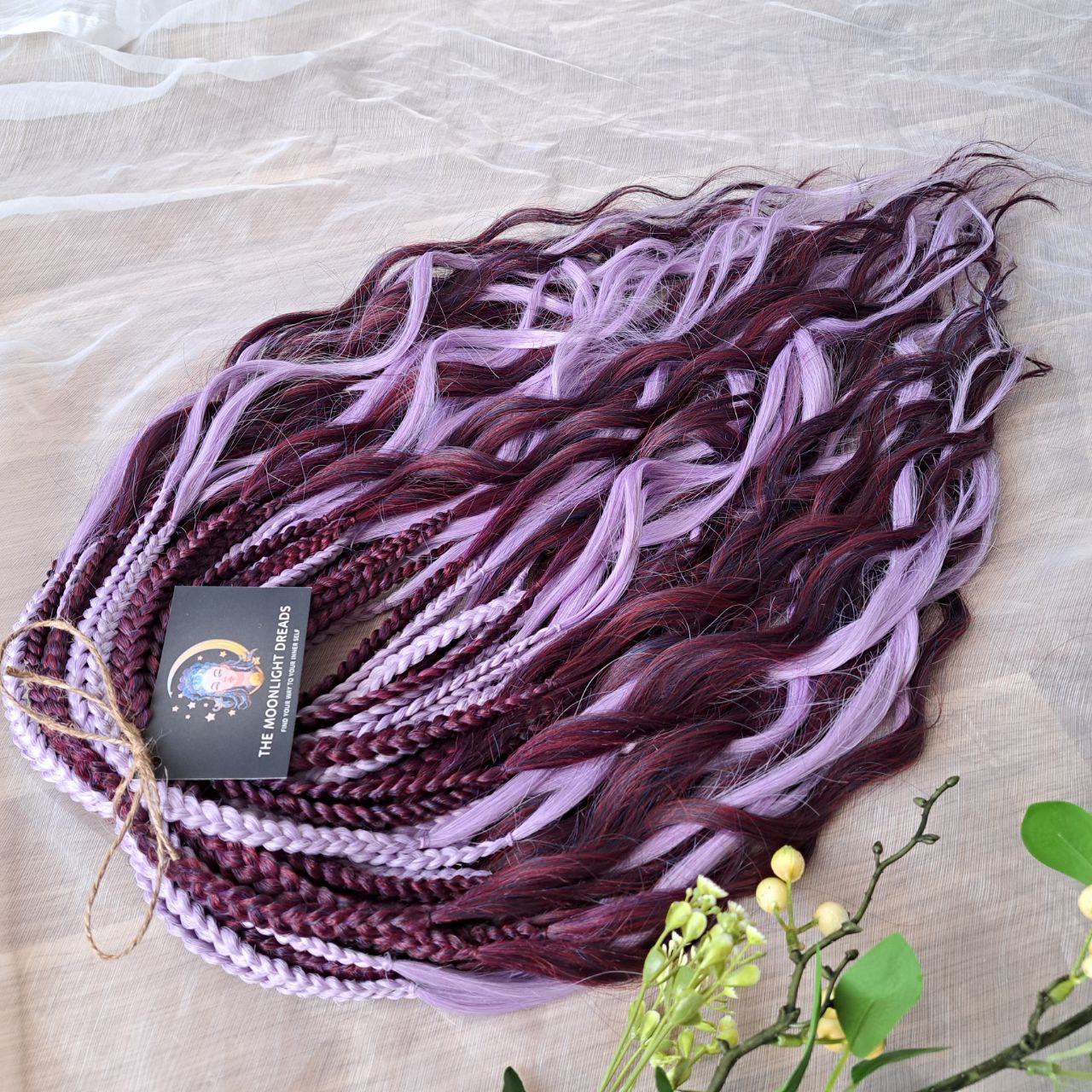 Plum Lilac - the base shade is a deep plum purple, combined with soft lilac strands. Soft, lightweight, and reusable double ended synthetic brushable curls.