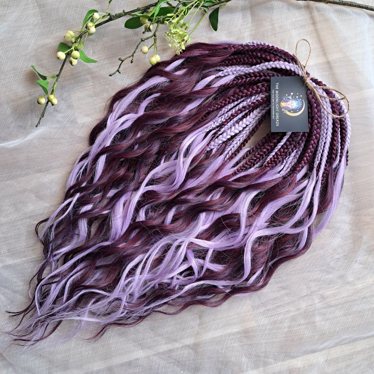 Plum Lilac - the base shade is a deep plum purple, combined with soft lilac strands. Soft, lightweight, and reusable double ended synthetic brushable curls.
