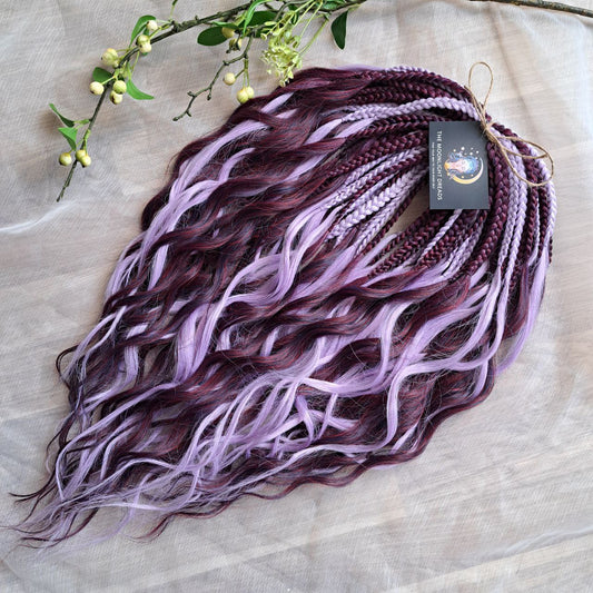 Plum Lilac - the base shade is a deep plum purple, combined with soft lilac strands. Soft, lightweight, and reusable double ended synthetic brushable curls.