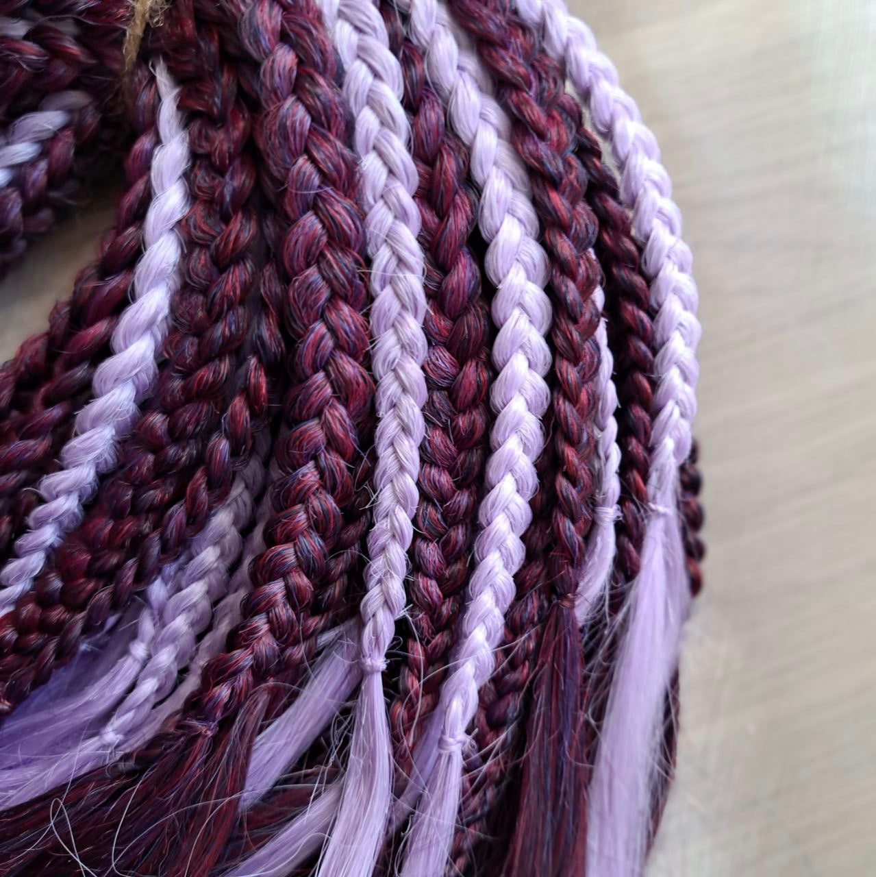 Plum Lilac - the base shade is a deep plum purple, combined with soft lilac strands. Soft, lightweight, and reusable double ended synthetic brushable curls.
