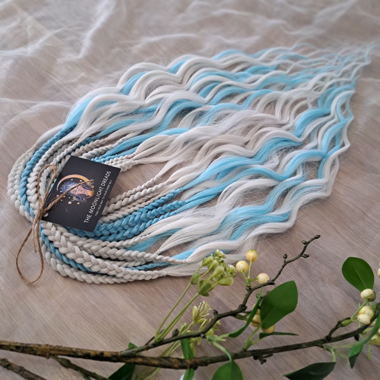 Step into a winter fairytale with "Frozen" - a dreamy blend of icy blue and snow-white shades. This set feels like a breath of frosty air and glows with cool, magical vibes. Soft, lightweight, and reusable synthetic brushable double ended wavy dreadlocks (regular dreaded, braided middle, or push-up). Let your style sparkle with a chill ❄️