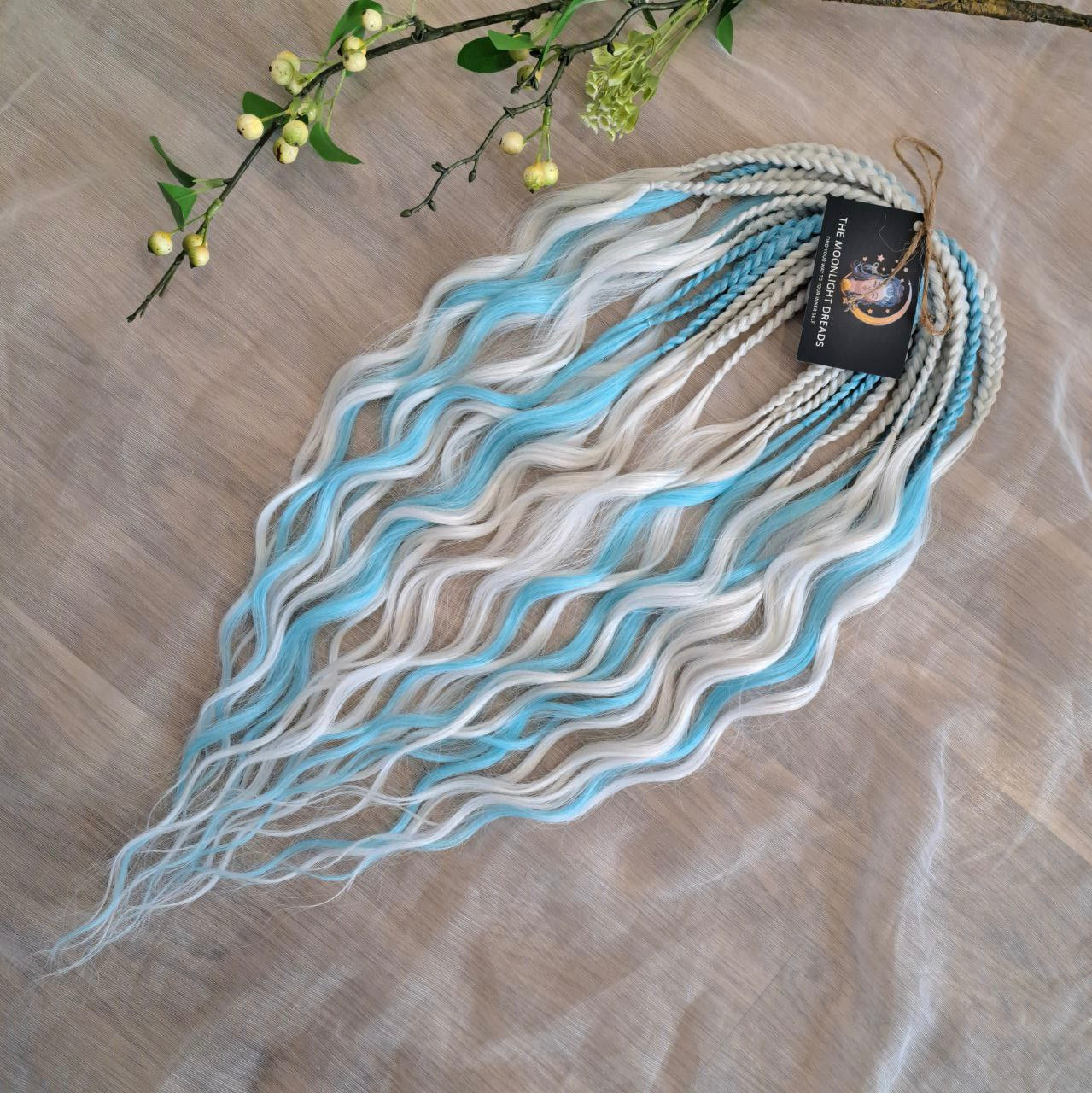 Step into a winter fairytale with "Frozen" - a dreamy blend of icy blue and snow-white shades. This set feels like a breath of frosty air and glows with cool, magical vibes. Soft, lightweight, and reusable synthetic brushable double ended wavy dreadlocks (regular dreaded, braided middle, or push-up). Let your style sparkle with a chill ❄️