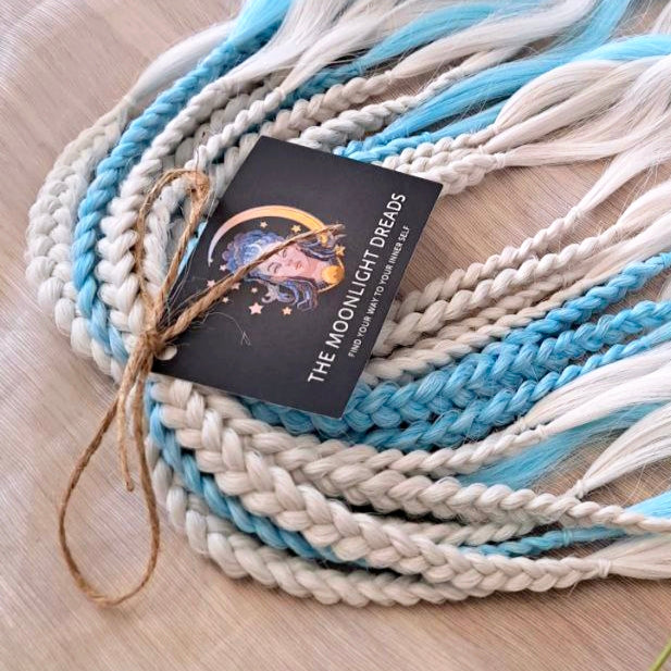 Step into a winter fairytale with "Frozen" - a dreamy blend of icy blue and snow-white shades. This set feels like a breath of frosty air and glows with cool, magical vibes. Soft, lightweight, and reusable synthetic brushable double ended wavy dreadlocks (regular dreaded, braided middle, or push-up). Let your style sparkle with a chill ❄️