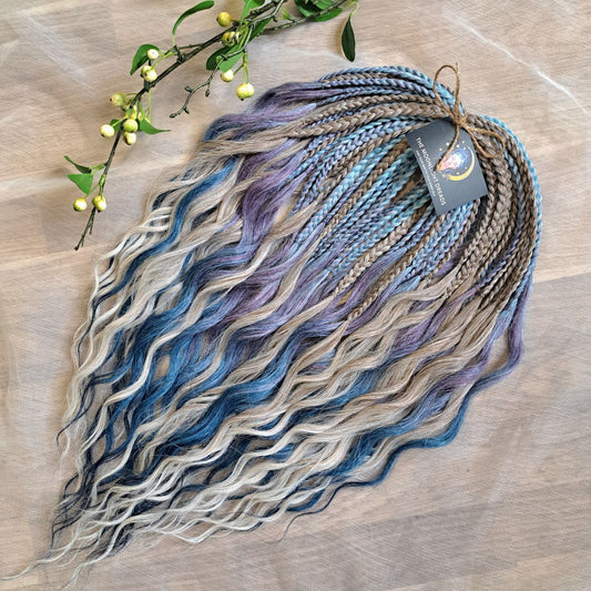 Soft, lightweight, and reusable double ended synthetic brushable curls. Ombre from ash to platinum blonde, and a cool transition from dusty blue into lavender and navy blue.