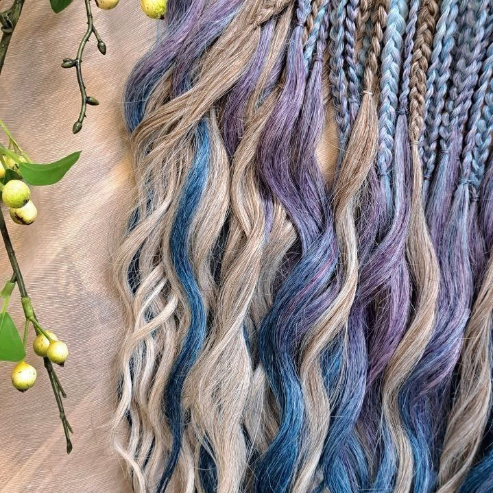 Soft, lightweight, and reusable double ended synthetic brushable curls. Ombre from ash to platinum blonde, and a cool transition from dusty blue into lavender and navy blue.