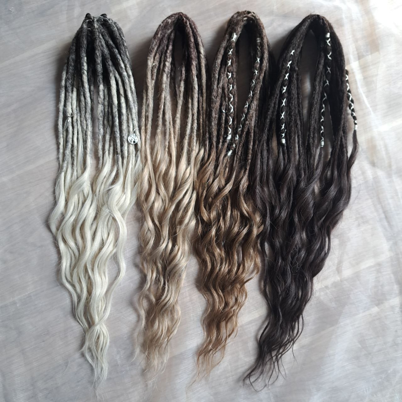 Soft, lightweight,  reusable synthetic double ended crochet dreadlocks, with curly brushable ends (colors based on the colors from the Smoky Mix set):

- chocolate brown;
- ombre from medium to light brown;
- ashy wheat blonde with dark roots;
- light blonde with dark roots.
