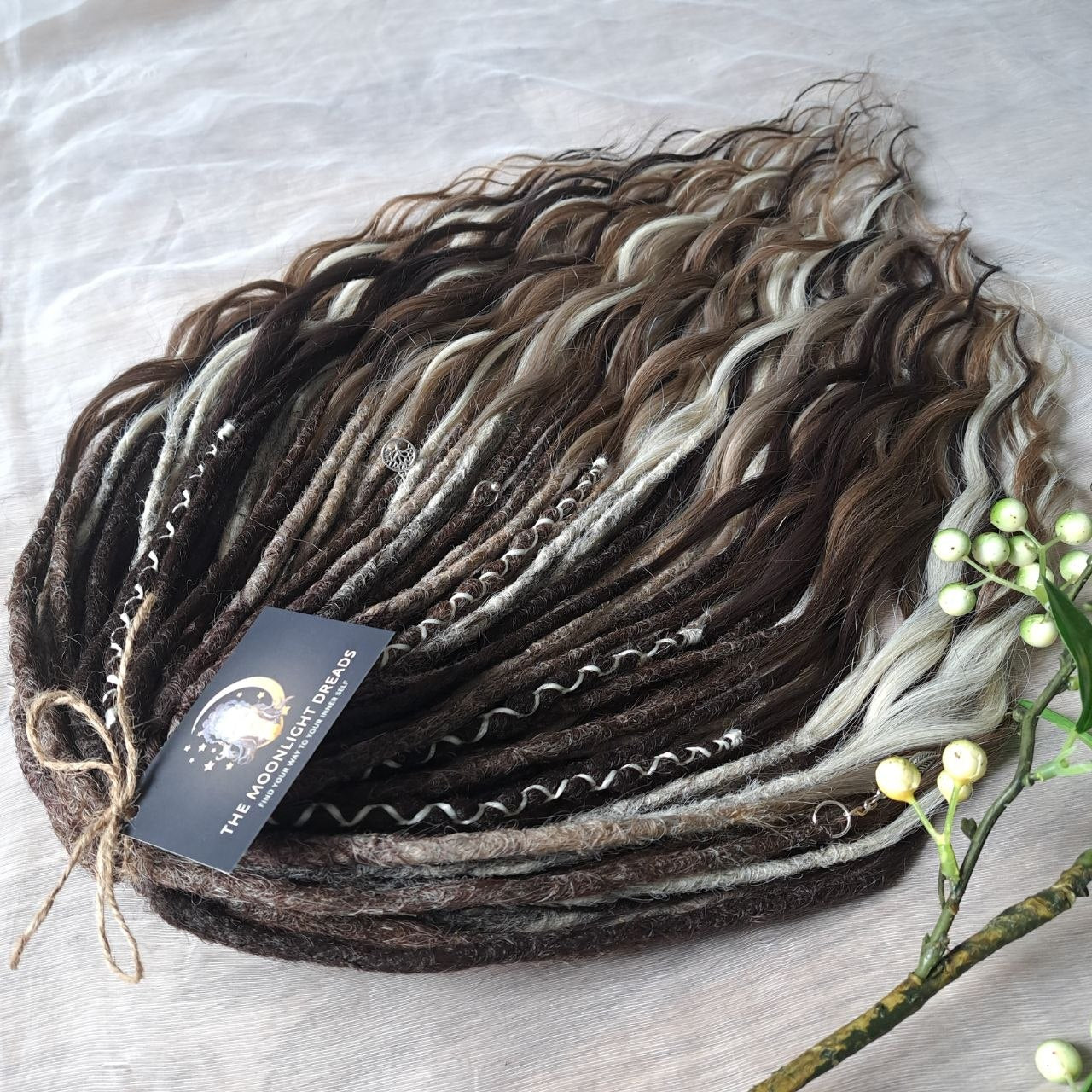 Soft, lightweight,  reusable synthetic double ended crochet dreadlocks, with curly brushable ends (colors based on the colors from the Smoky Mix set):

- chocolate brown;
- ombre from medium to light brown;
- ashy wheat blonde with dark roots;
- light blonde with dark roots.
