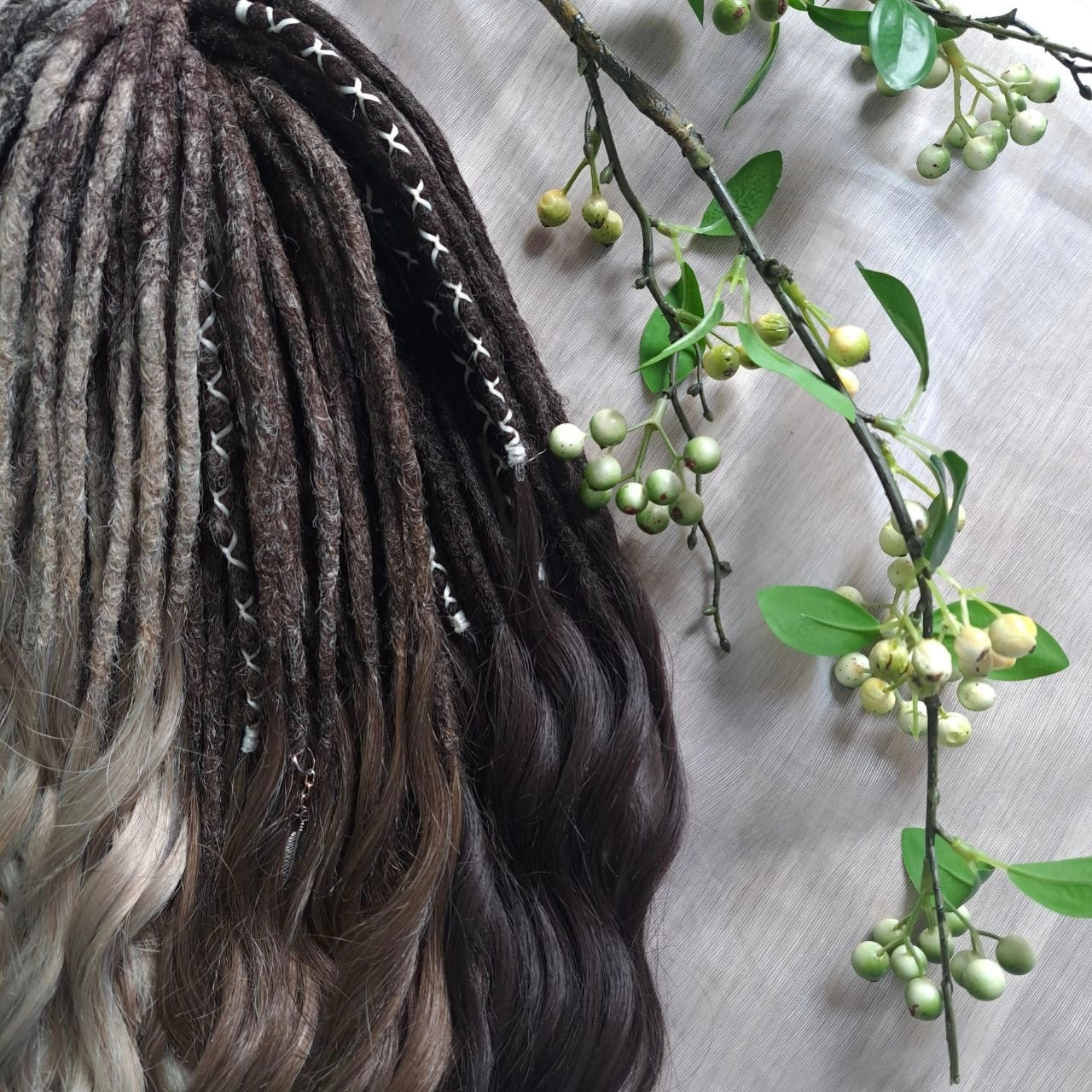 Soft, lightweight,  reusable synthetic double ended crochet dreadlocks, with curly brushable ends (colors based on the colors from the Smoky Mix set):

- chocolate brown;
- ombre from medium to light brown;
- ashy wheat blonde with dark roots;
- light blonde with dark roots.
