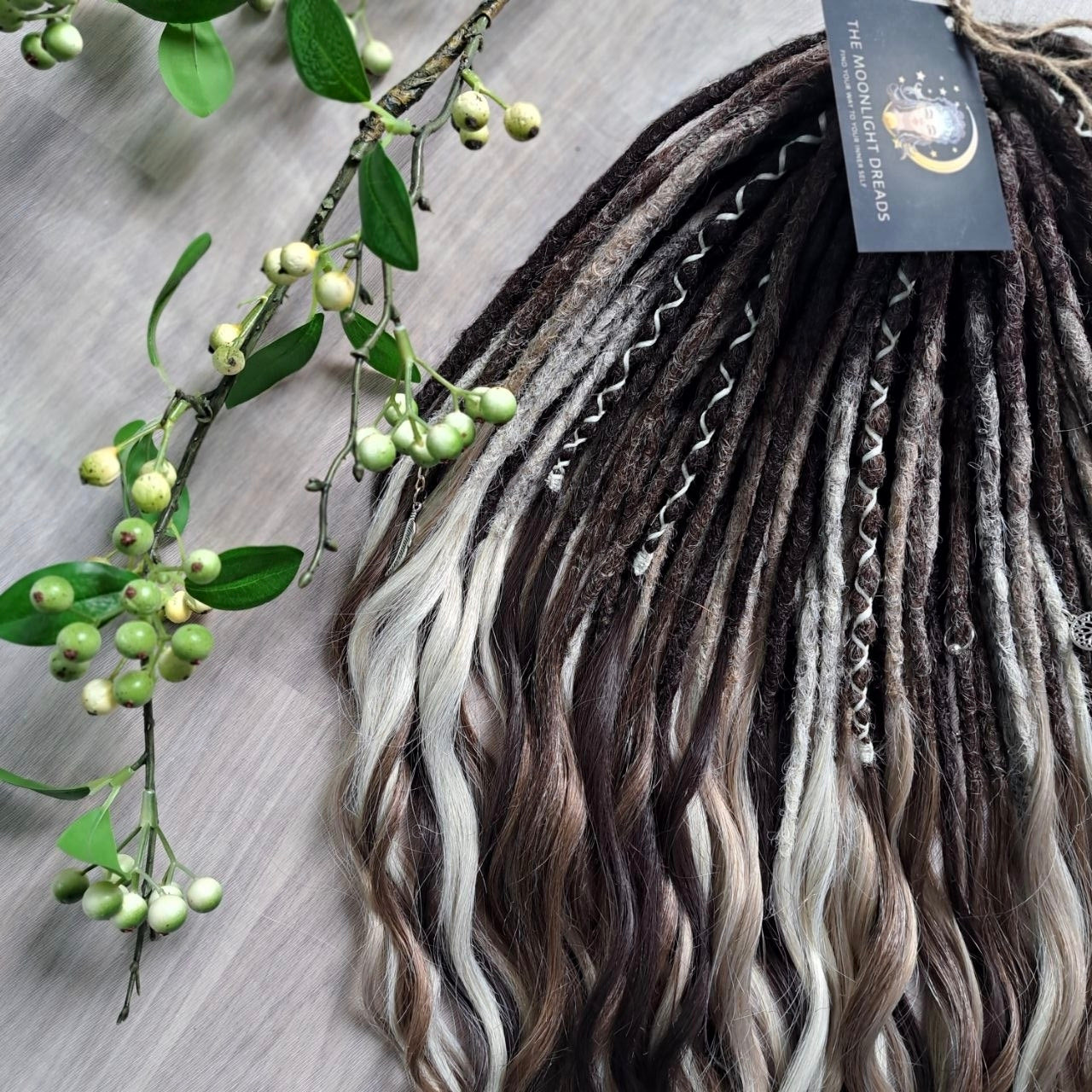 Soft, lightweight,  reusable synthetic double ended crochet dreadlocks, with curly brushable ends (colors based on the colors from the Smoky Mix set):

- chocolate brown;
- ombre from medium to light brown;
- ashy wheat blonde with dark roots;
- light blonde with dark roots.
