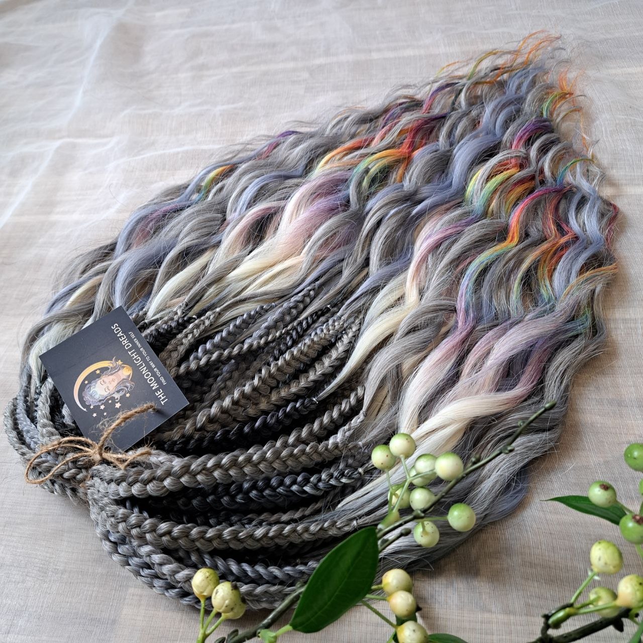Rainbow Ash - smoky silver, graphite, and rainbow/prism with icy blonde highlights. Soft, lightweight, and reusable synthetic brushable double ended wavy dreadlocks (regular dreaded, braided middle, or push-up).