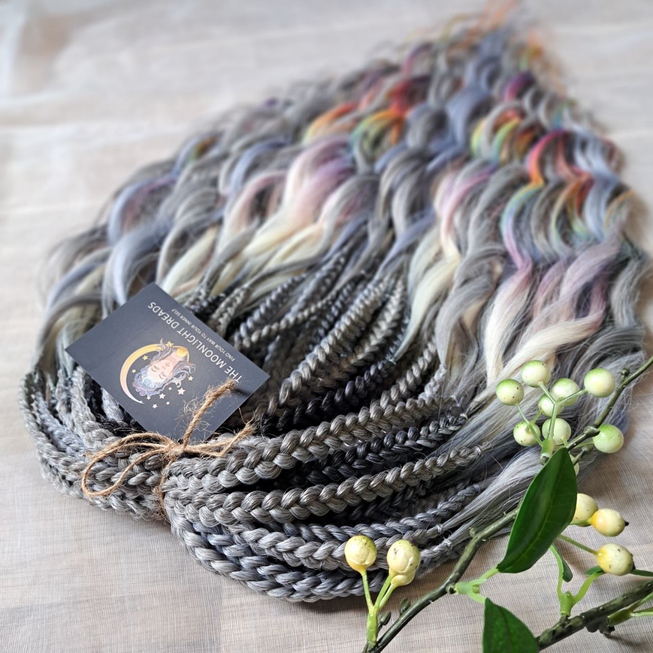 Rainbow Ash - smoky silver, graphite, and rainbow/prism with icy blonde highlights. Soft, lightweight, and reusable synthetic brushable double ended wavy dreadlocks (regular dreaded, braided middle, or push-up).