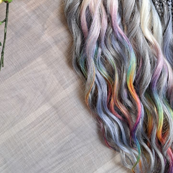Rainbow Ash - smoky silver, graphite, and rainbow/prism with icy blonde highlights. Soft, lightweight, and reusable synthetic brushable double ended wavy dreadlocks (regular dreaded, braided middle, or push-up).