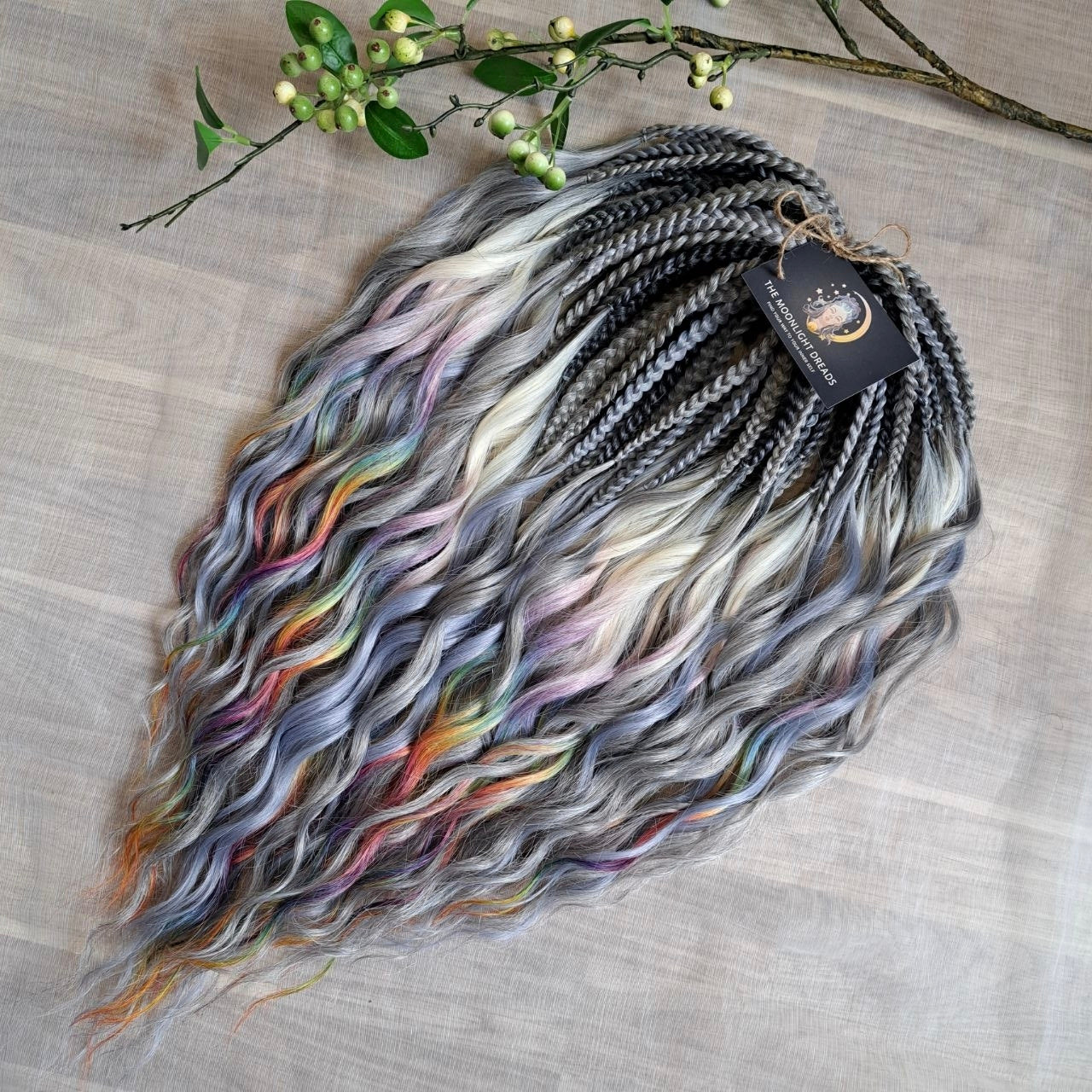 Rainbow Ash - smoky silver, graphite, and rainbow/prism with icy blonde highlights. Soft, lightweight, and reusable synthetic brushable double ended wavy dreadlocks (regular dreaded, braided middle, or push-up).