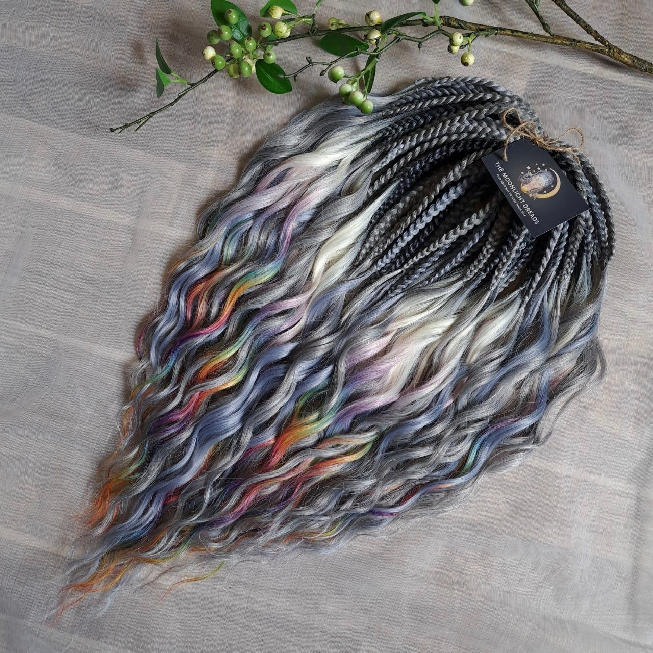 Rainbow Ash - smoky silver, graphite, and rainbow/prism with icy blonde highlights. Soft, lightweight, and reusable synthetic brushable double ended wavy dreadlocks (regular dreaded, braided middle, or push-up).