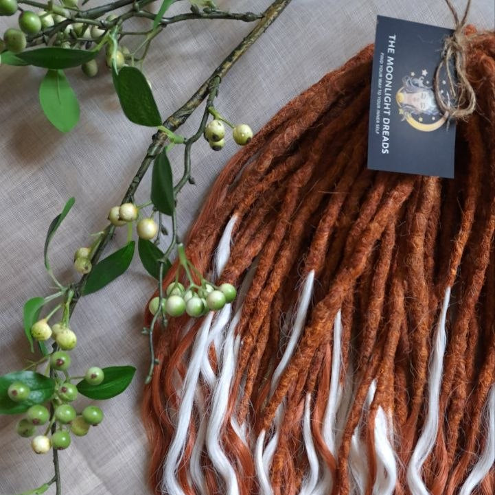 Crochet dreadlocks with wavy, wispy ends. Warm copper and terracotta tones combined with crisp white strands. Worn once during 4 weeks. Has been washed and corrected. Very good condition.

Quantity: 52 DE&nbsp;
Length: ±24 inches (60 cm)
Weight: ±16,6 oz (470 gr)