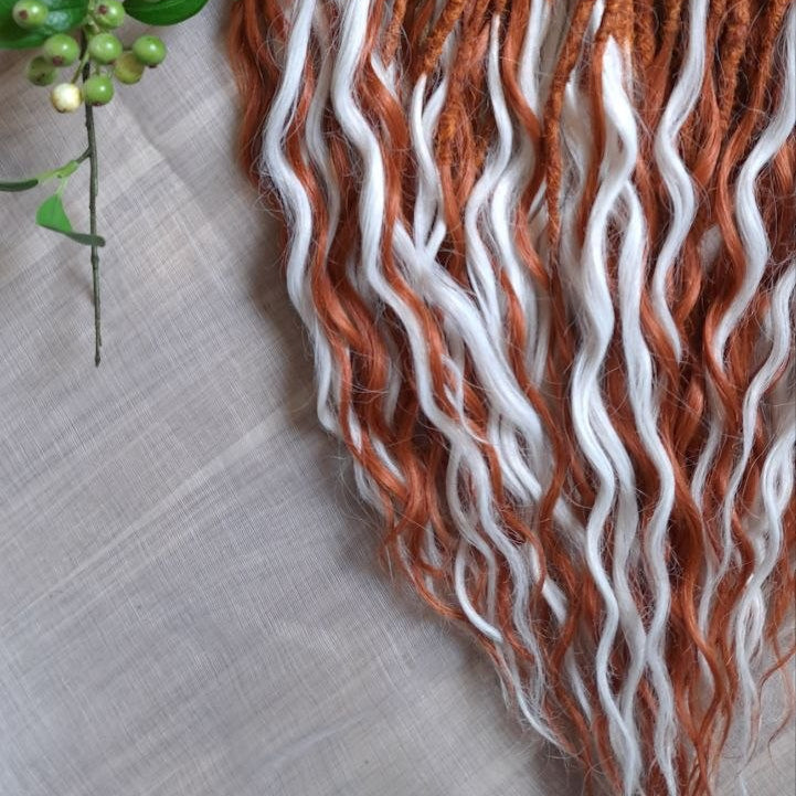 Crochet dreadlocks with wavy, wispy ends. Warm copper and terracotta tones combined with crisp white strands. Worn once during 4 weeks. Has been washed and corrected. Very good condition.

Quantity: 52 DE&nbsp;
Length: ±24 inches (60 cm)
Weight: ±16,6 oz (470 gr)