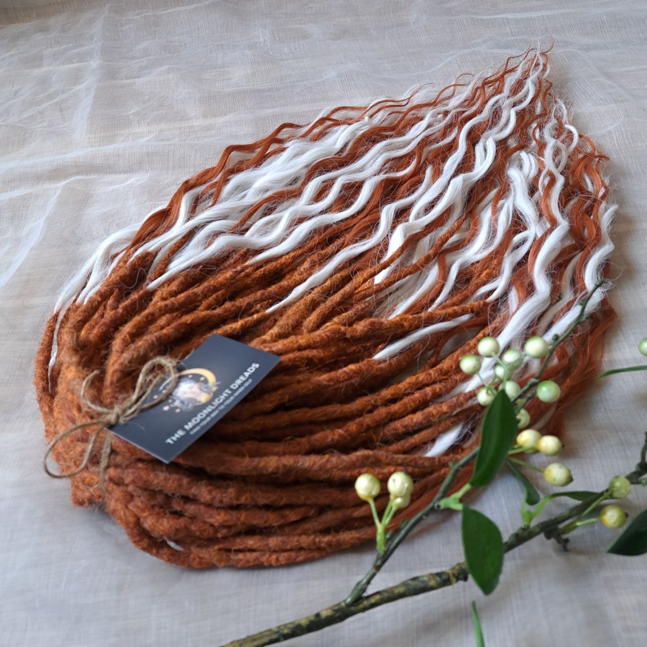 Crochet dreadlocks with wavy, wispy ends. Warm copper and terracotta tones combined with crisp white strands. Worn once during 4 weeks. Has been washed and corrected. Very good condition.

Quantity: 52 DE&nbsp;
Length: ±24 inches (60 cm)
Weight: ±16,6 oz (470 gr)