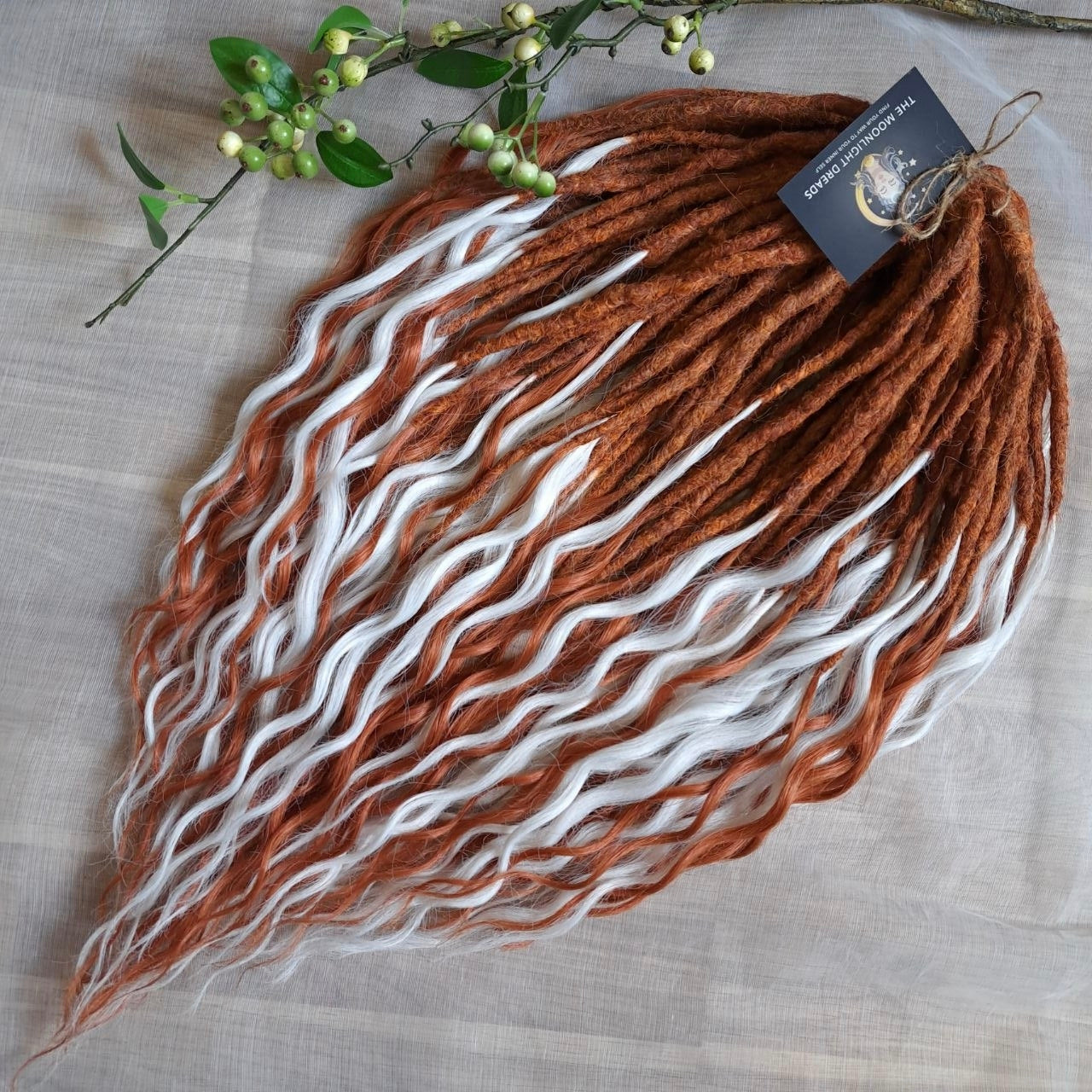 Crochet dreadlocks with wavy, wispy ends. Warm copper and terracotta tones combined with crisp white strands. Worn once during 4 weeks. Has been washed and corrected. Very good condition.

Quantity: 52 DE&nbsp;
Length: ±24 inches (60 cm)
Weight: ±16,6 oz (470 gr)