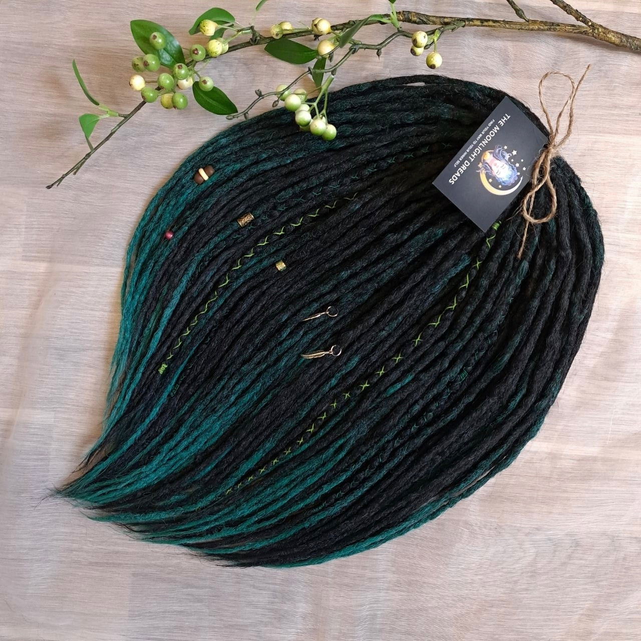 Deep forest dreads - Black and ombre emerald synthetic set of 50 double ended crochet dreadlocks.

Length: ±18-20 inches (45-50 cm)
Thickness of dreads and braids: ±0.8-1 cm
Weight with decoration: ±315 gr (11 oz)