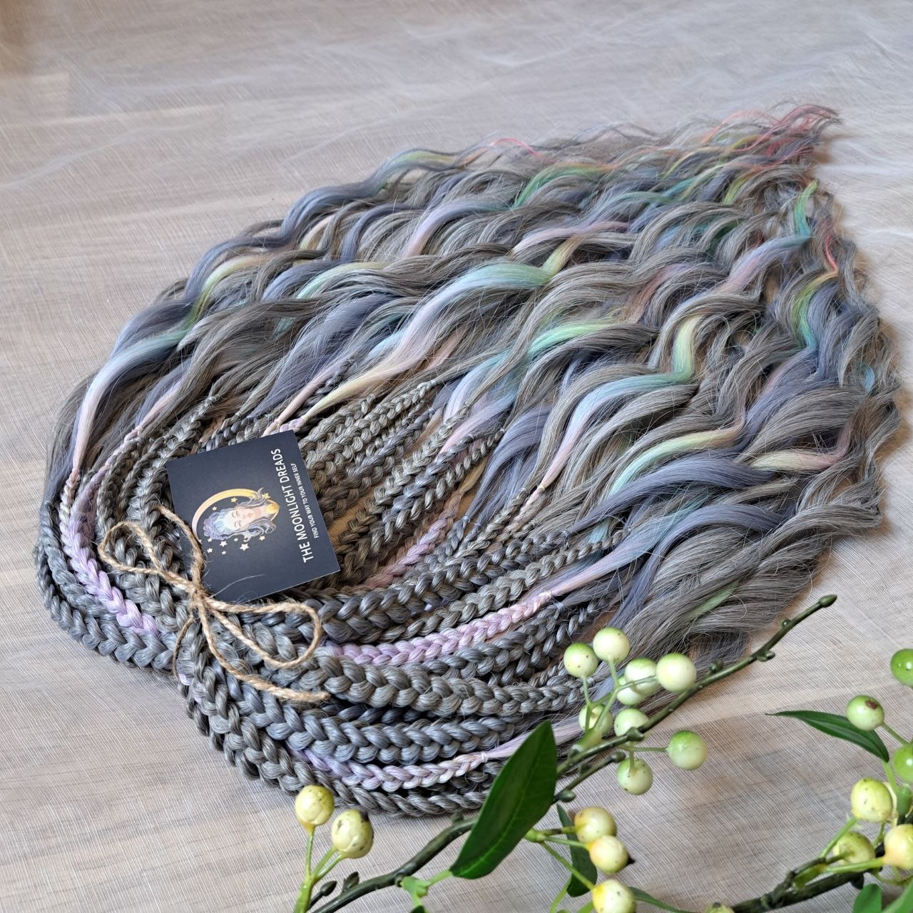 Moon Pearl - soft, lightweight, and reusable synthetic brushable double ended wavy dreadlocks (regular dreaded, braided middle, or push-up).

A blend of pearl grey, icy blue, soft mint, lavender, and blush pink - subtle, airy, and full of depth. The pastel shades appear gently throughout the set, creating a shimmering effect without overpowering the base color.