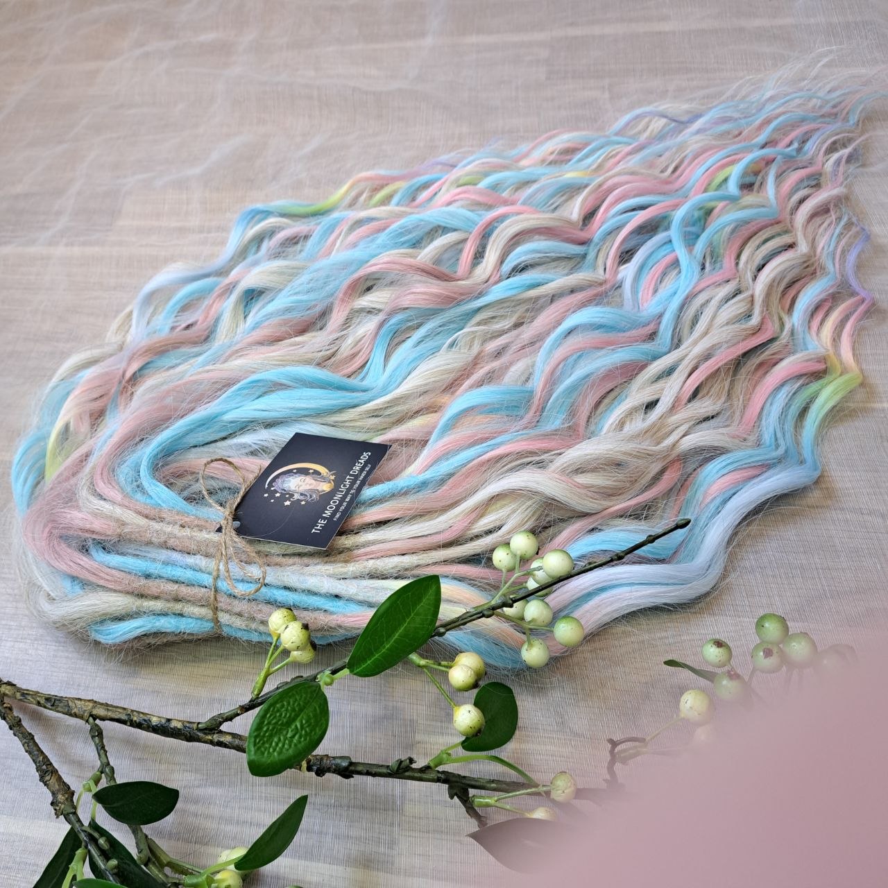 Ready to Ship: Cotton Candy - soft, lightweight, and reusable 50 double ended synthetic brushable dreaded curls. A blend of platinum blonde, sky blue, pink, and rainbow colors creates a light, airy look full of soft color transitions.

Length: 22-24 inches (55-60 cm)
Dreaded part (one-side dreaded): ±4-5 inches (±10-12 cm)
Weight: ±300 gr (10,6 oz)
