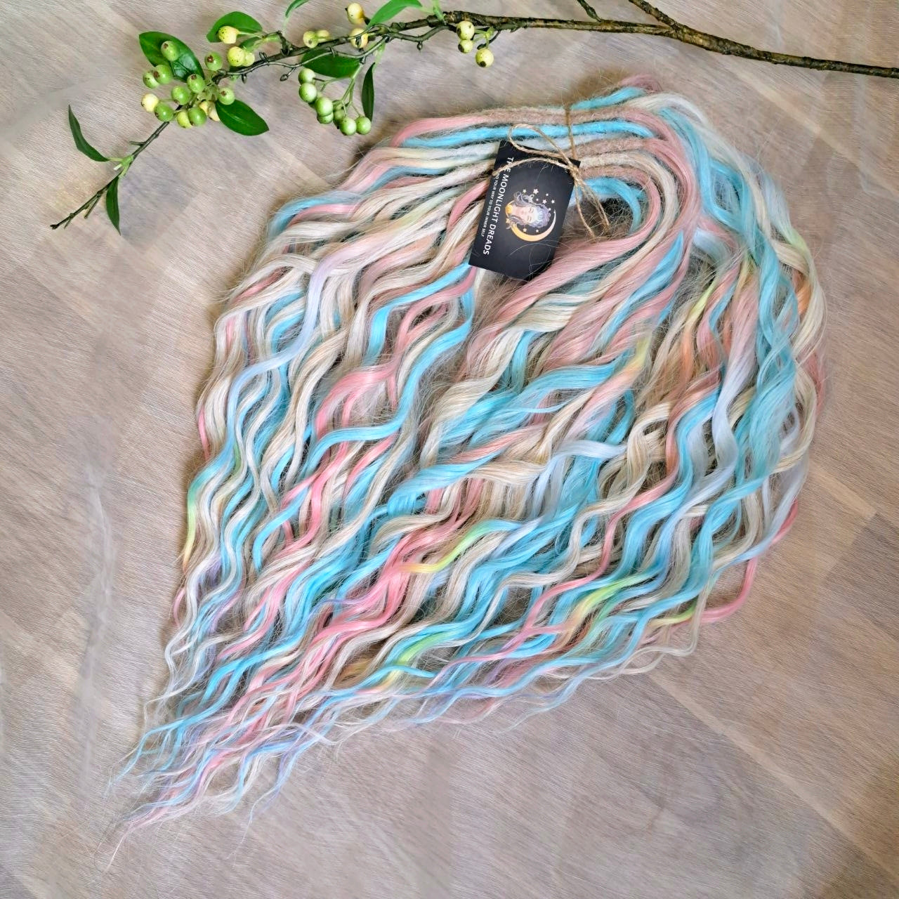 Ready to Ship: Cotton Candy - soft, lightweight, and reusable 50 double ended synthetic brushable dreaded curls. A blend of platinum blonde, sky blue, pink, and rainbow colors creates a light, airy look full of soft color transitions.

Length: 22-24 inches (55-60 cm)
Dreaded part (one-side dreaded): ±4-5 inches (±10-12 cm)
Weight: ±300 gr (10,6 oz)