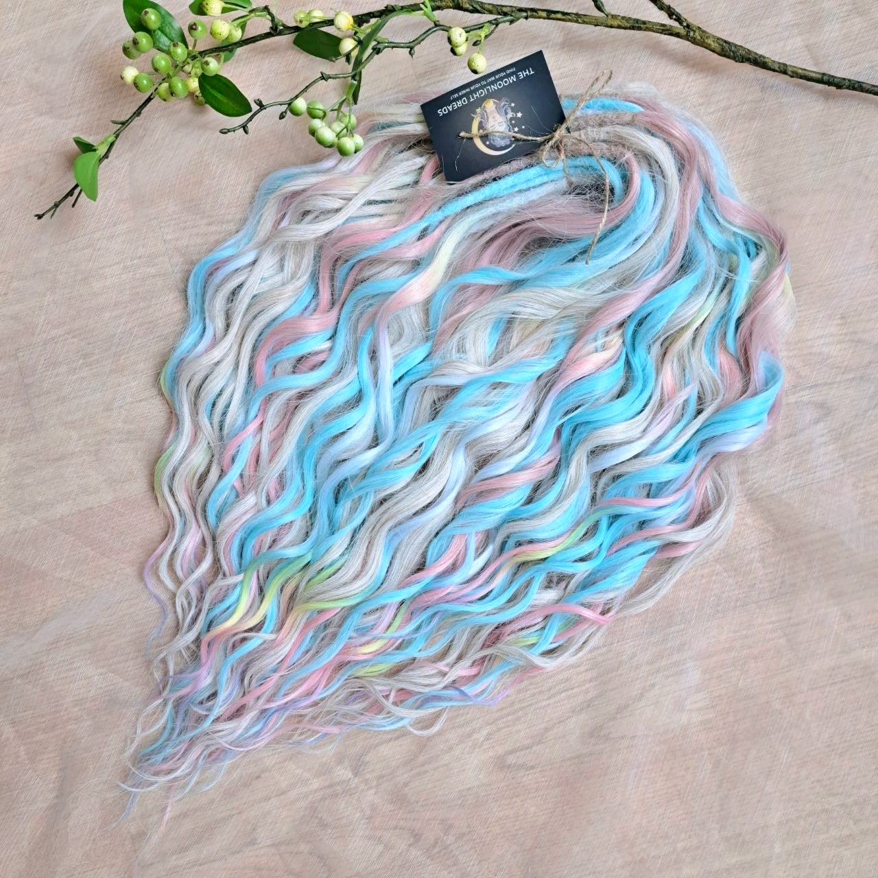 Ready to Ship: Cotton Candy - soft, lightweight, and reusable 50 double ended synthetic brushable dreaded curls. A blend of platinum blonde, sky blue, pink, and rainbow colors creates a light, airy look full of soft color transitions.

Length: 22-24 inches (55-60 cm)
Dreaded part (one-side dreaded): ±4-5 inches (±10-12 cm)
Weight: ±300 gr (10,6 oz)