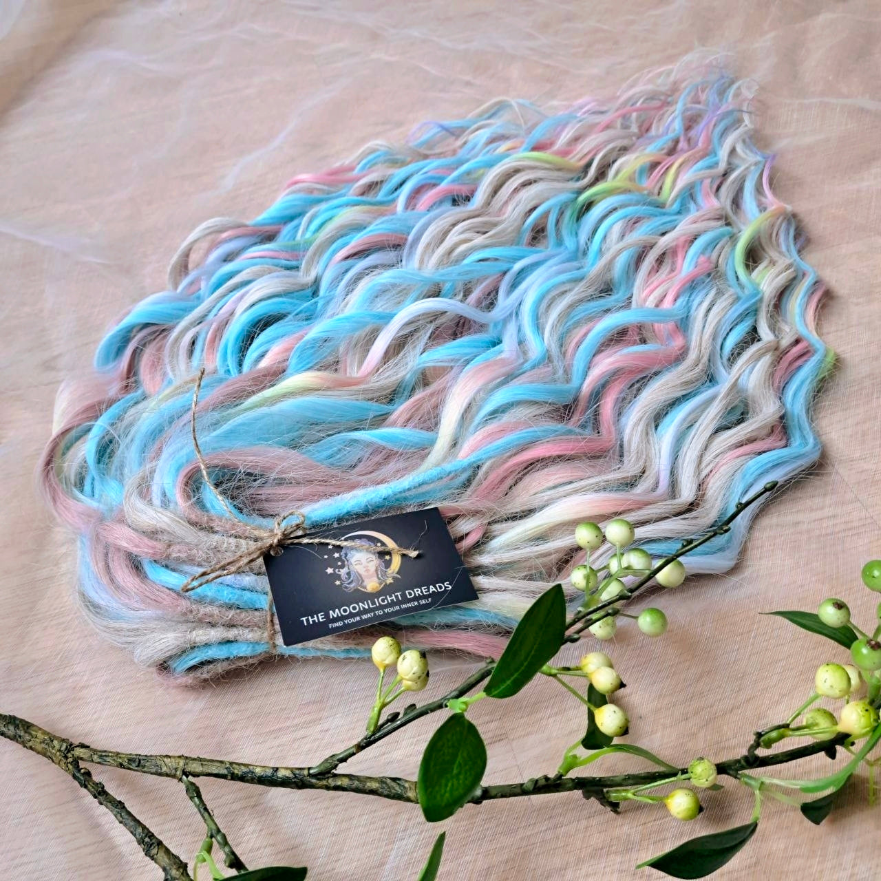 Ready to Ship: Cotton Candy - soft, lightweight, and reusable 50 double ended synthetic brushable dreaded curls. A blend of platinum blonde, sky blue, pink, and rainbow colors creates a light, airy look full of soft color transitions.

Length: 22-24 inches (55-60 cm)
Dreaded part (one-side dreaded): ±4-5 inches (±10-12 cm)
Weight: ±300 gr (10,6 oz)