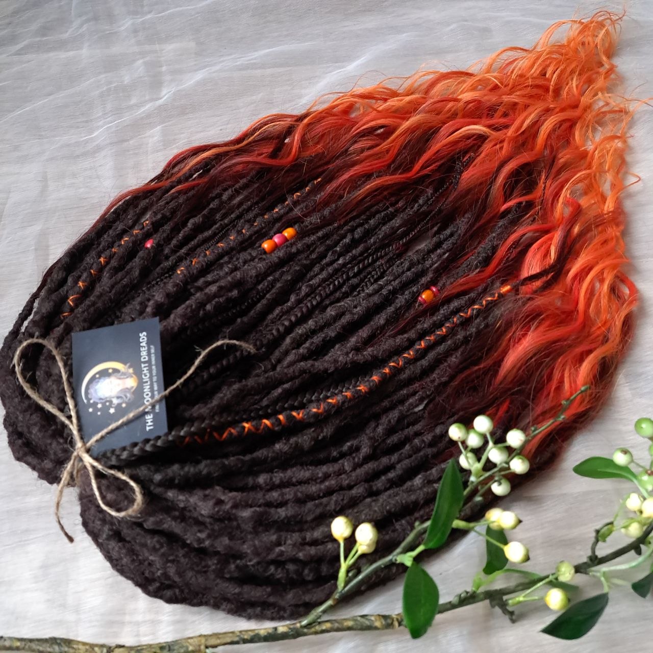 Phoenix - dark chocolate brown and fiery red soft, lightweight, reusable synthetic 50 double ended crochet dreads, with curly brushable ends 

Length: ±28-30 inches (73-75 cm)
Thickness of dreads: ±0.8-1 cm
Weight: ±410 gr (14,5 oz)