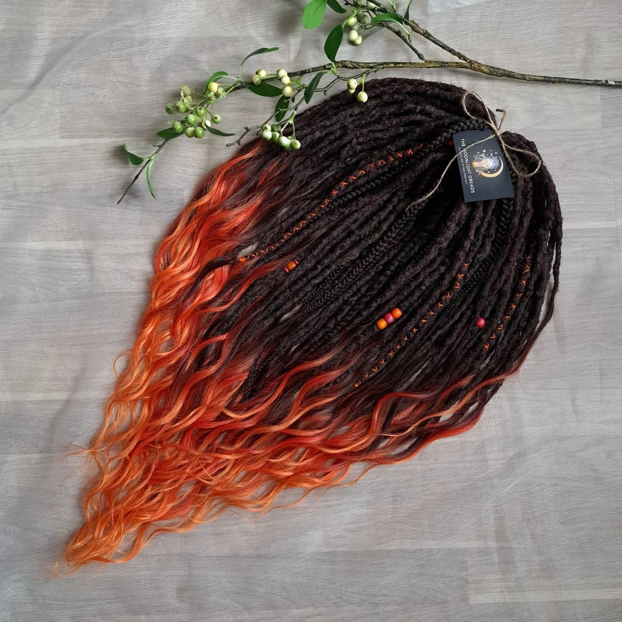 Phoenix - dark chocolate brown and fiery red soft, lightweight, reusable synthetic 50 double ended crochet dreads, with curly brushable ends 

Length: ±28-30 inches (73-75 cm)
Thickness of dreads: ±0.8-1 cm
Weight: ±410 gr (14,5 oz)