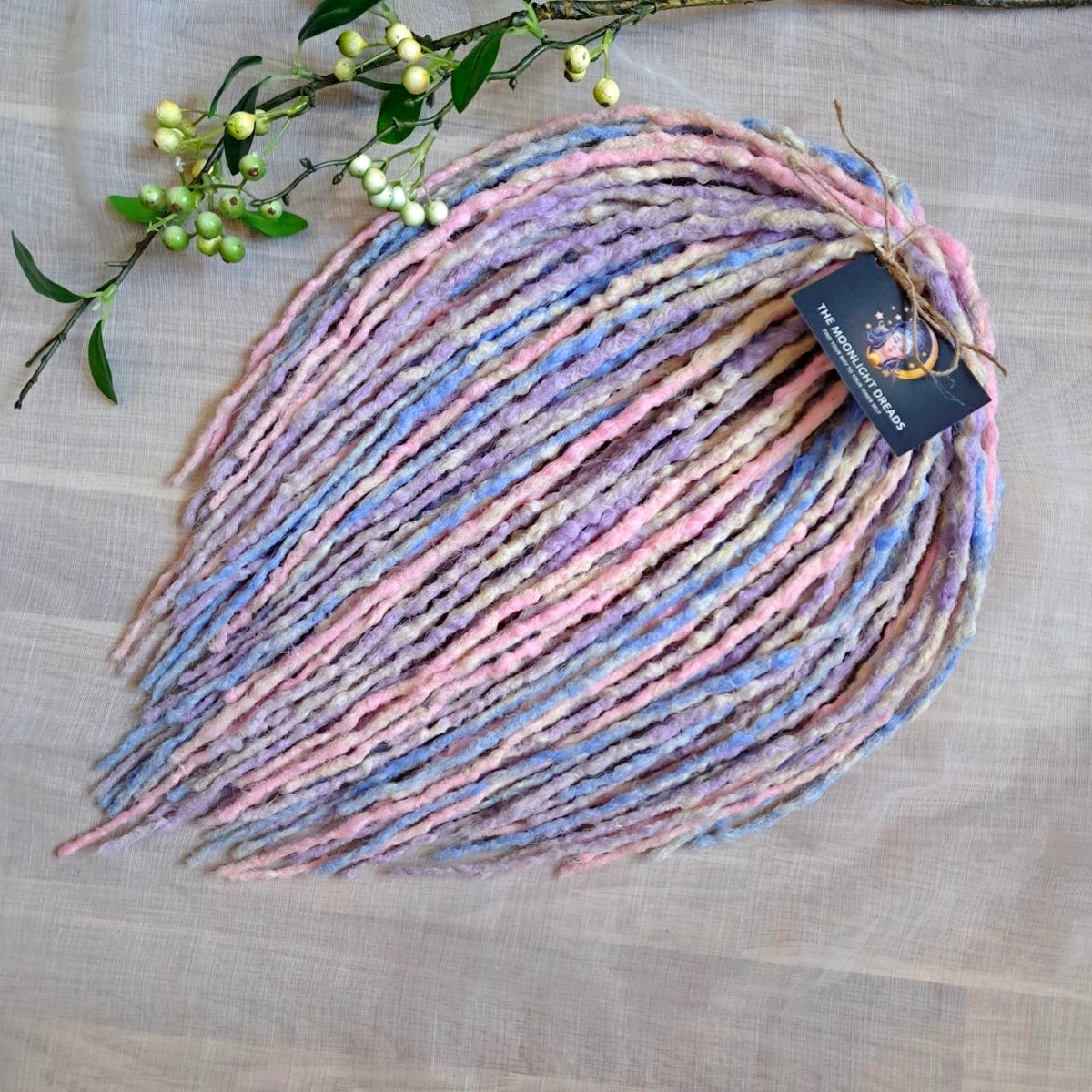 Pastel Cloud - a soft pastel mix of lavender, baby blue, blush pink, and creamy blonde. Soft, lightweight, and reusable 49 double ended synthetic bumpy dreadlocks with blunt ends give a calm, airy look.

Length: ≈15-16 inches (≈38-40 cm)
Thickness of dreads and braids: ≈0.8-1 cm
Weight: ≈260 gr (≈9,17 oz)
